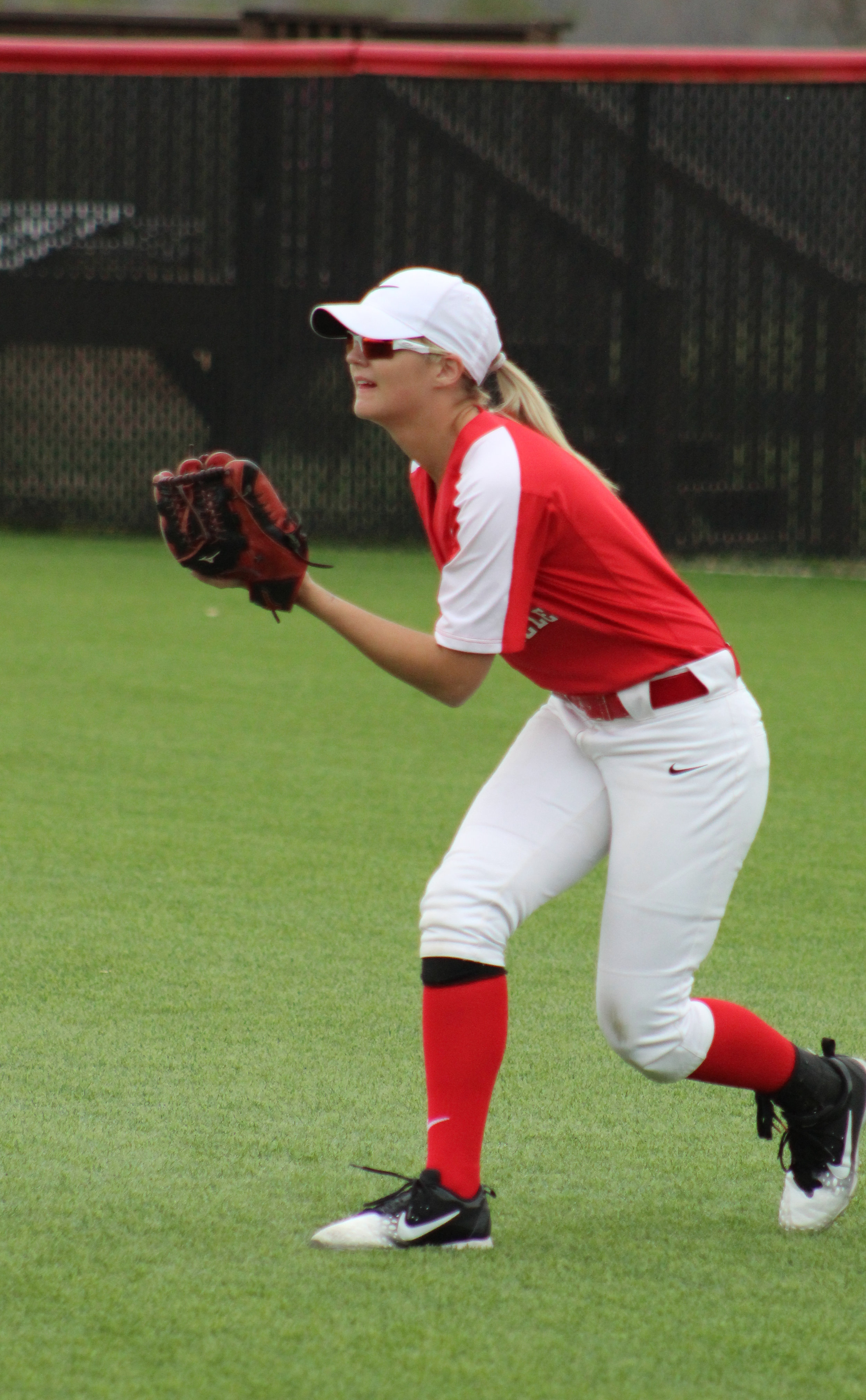 Freshman, Makayla Brackett, 1, awaits in the outfield for the ball.