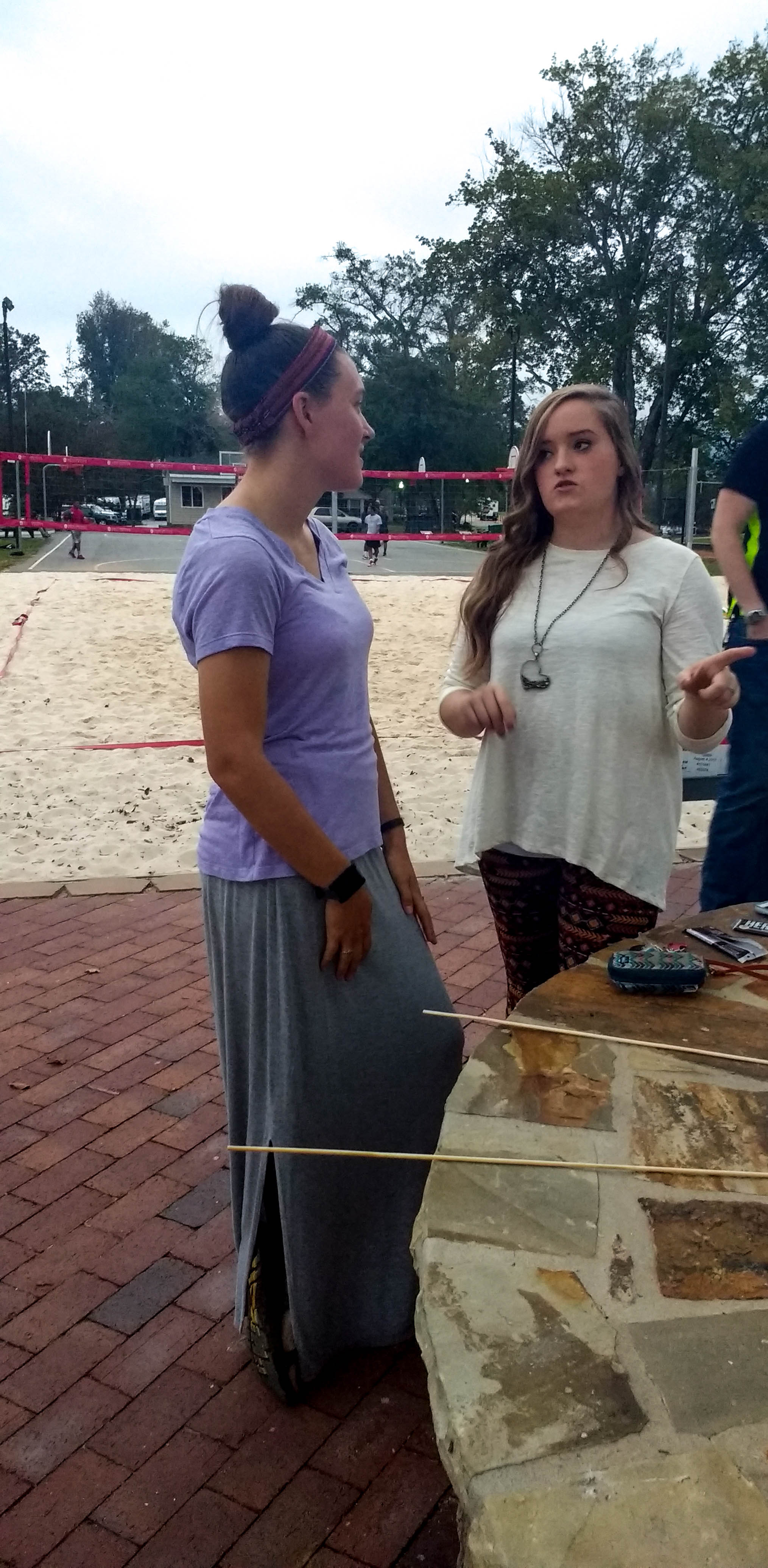 Rebecca Komoroski (Senior)&nbsp;and Christine Adcock (Senior)&nbsp;talking over s'mores.