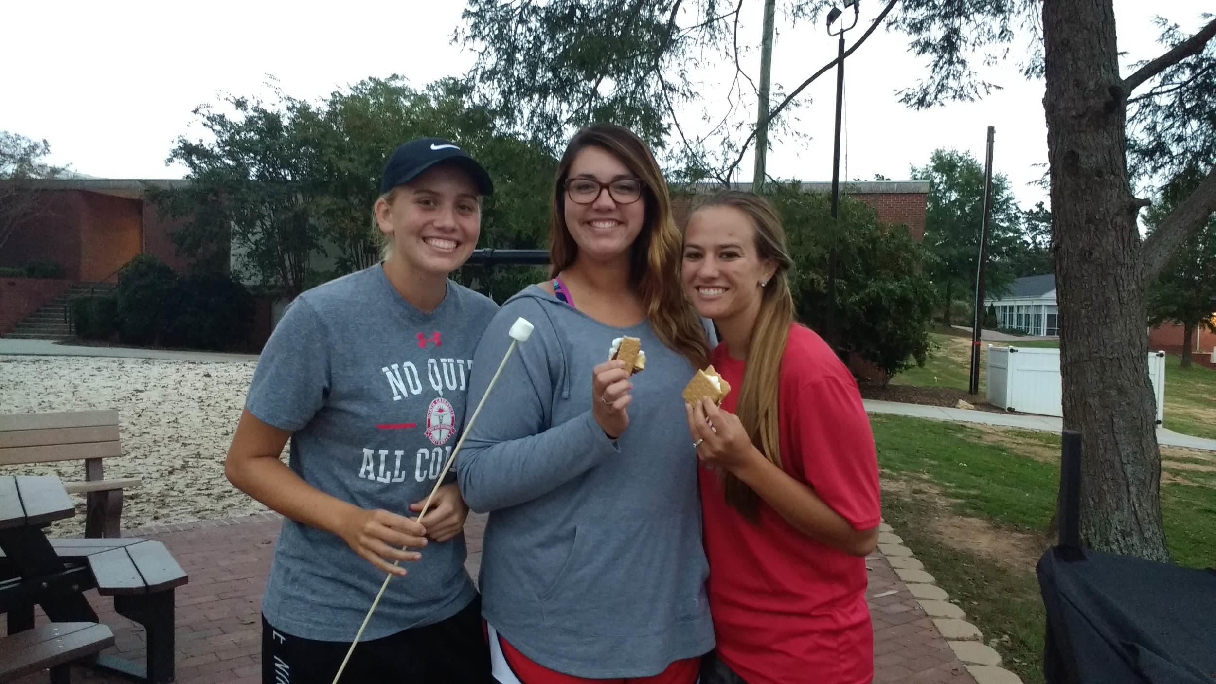 Taylor Koon (Freshman), Brooklyn Fort (Senior)&nbsp;and Morgan Herlong (Senior)&nbsp;posing with their s'mores.&nbsp;