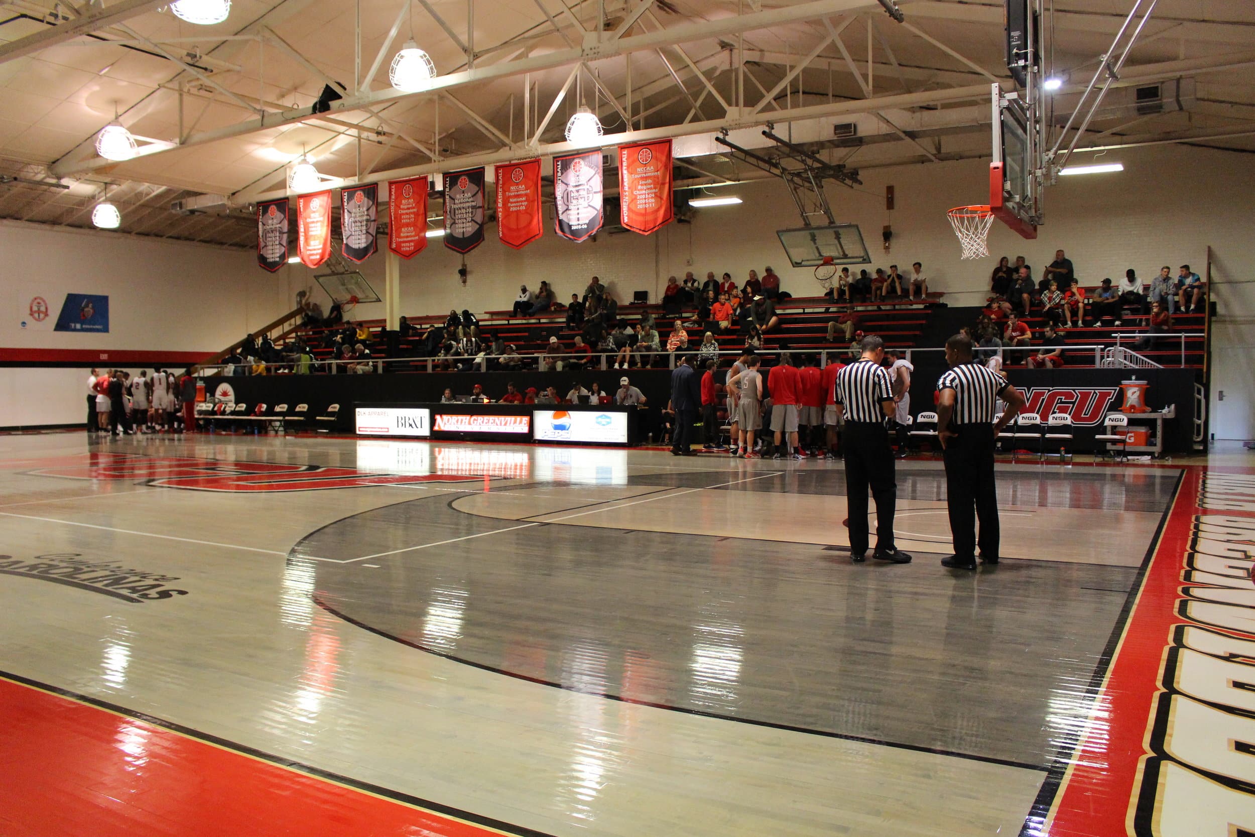  Referees wait on the teams during a quick time out.&nbsp; 