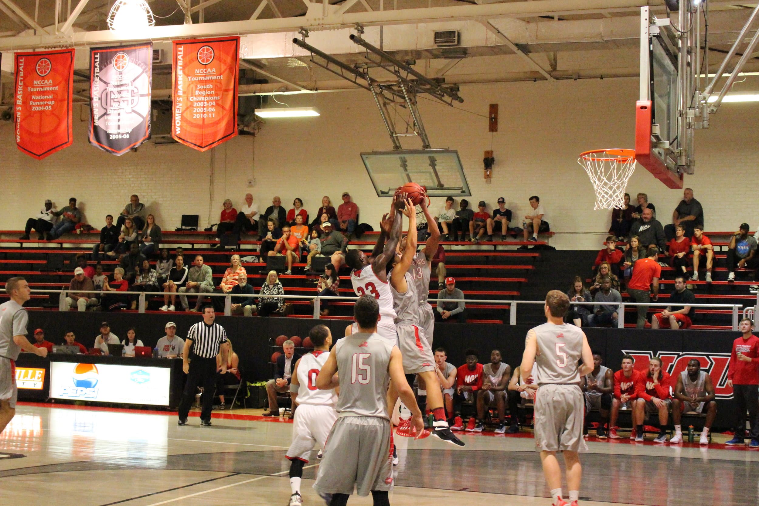  Both teams' players go up to rebound the basketball.&nbsp; 