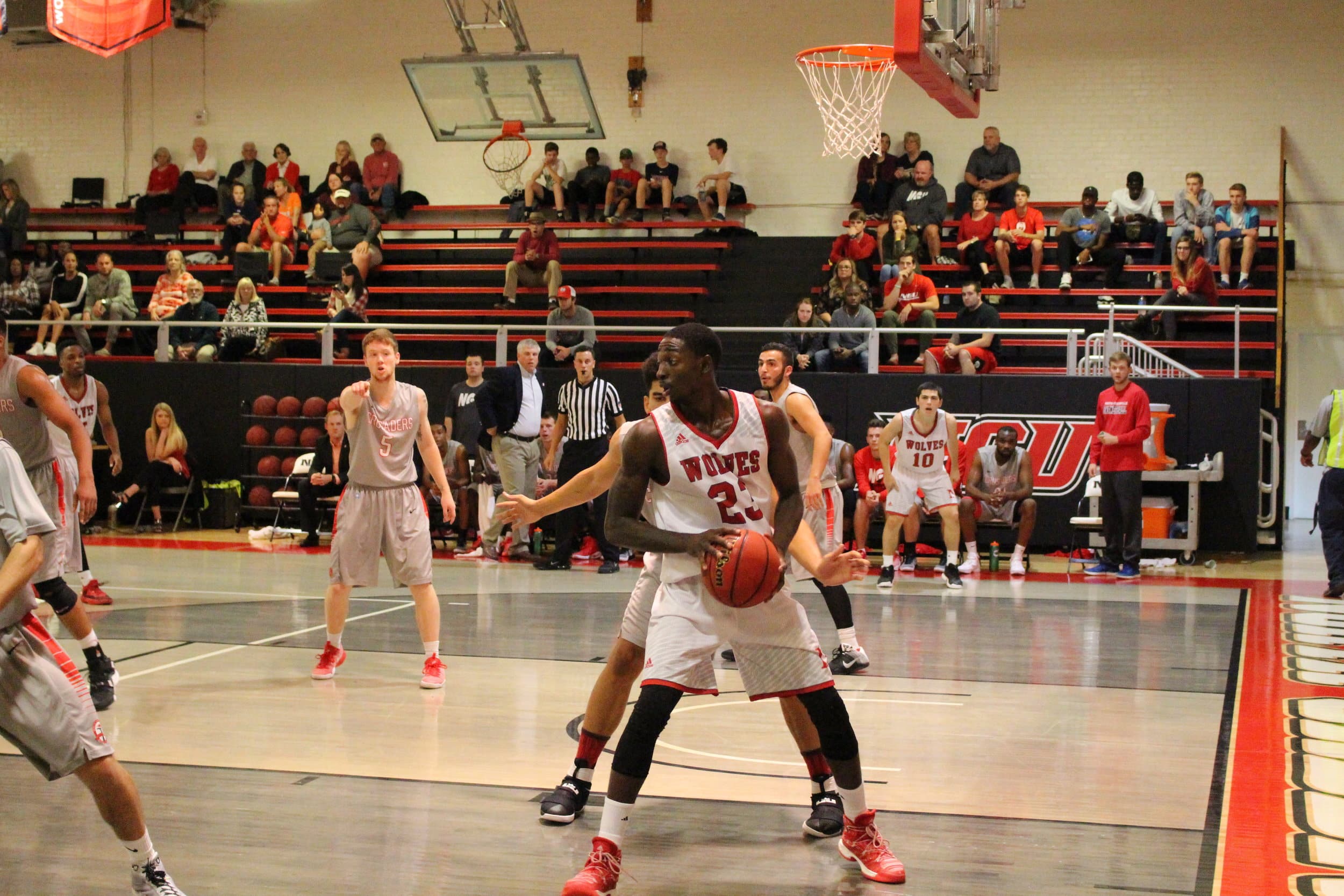  Opposing team player tries to find a way around NGU player.&nbsp; 