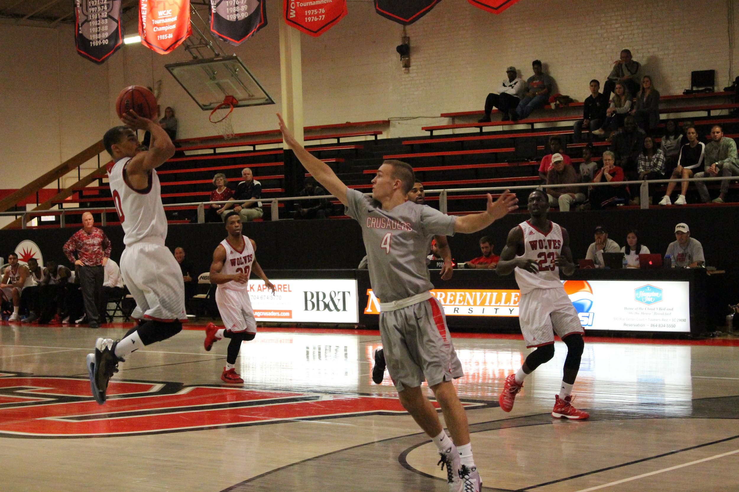  Daniel Burchette, sophomore, goes up to contest a shot. 