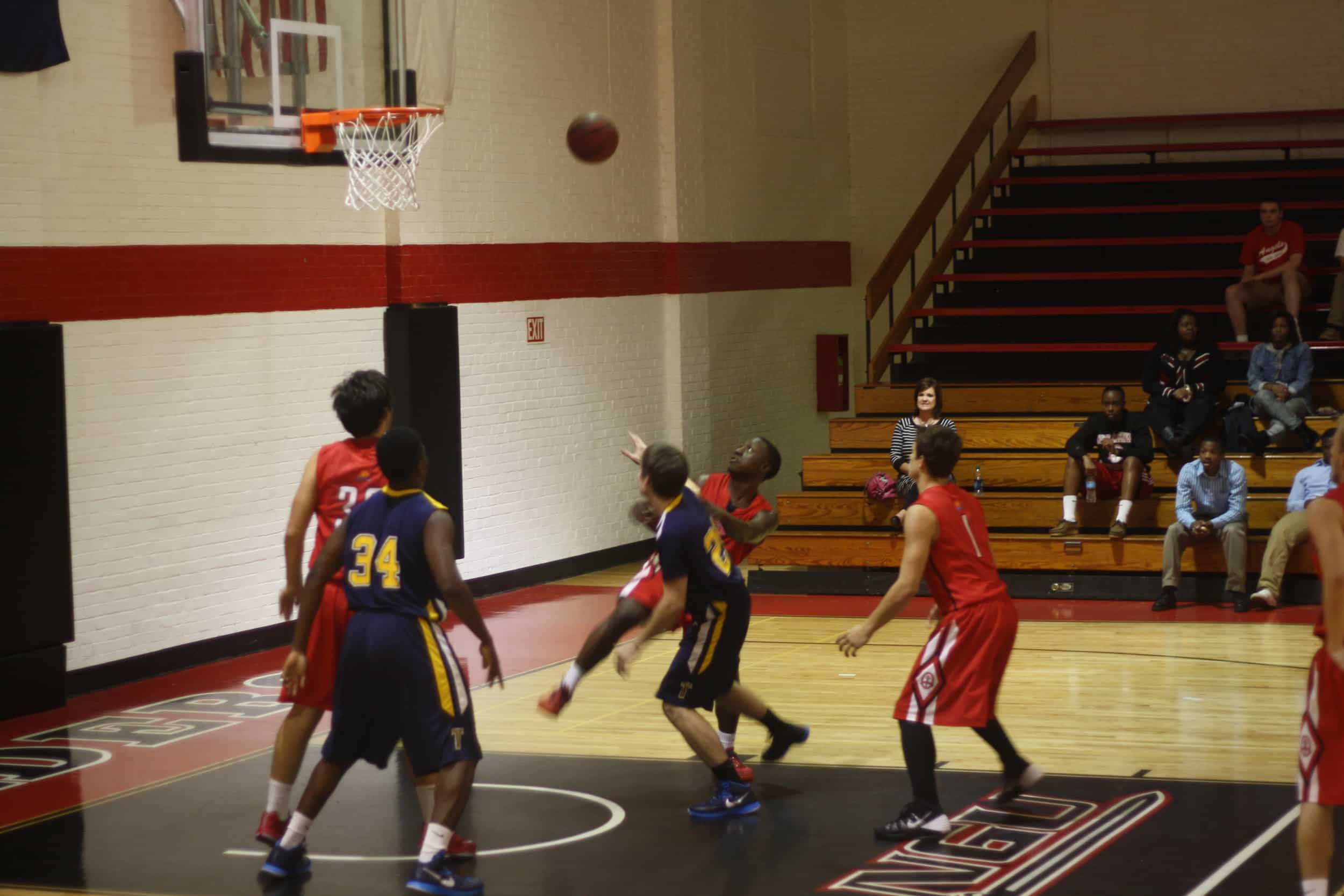  Three NGU JV basketball players attempt&nbsp;to get the rebound. 