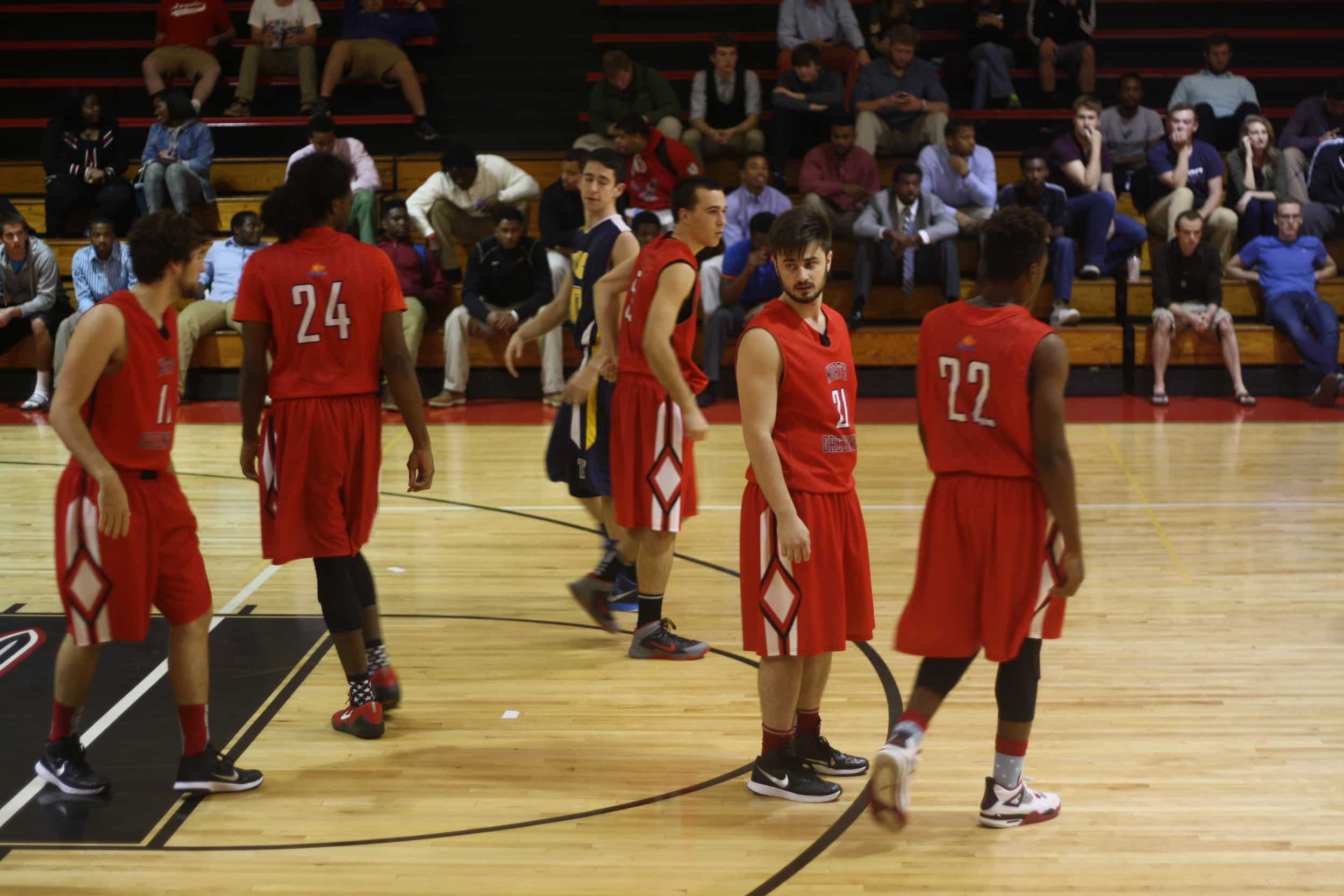  NGU players take their places on the court. 