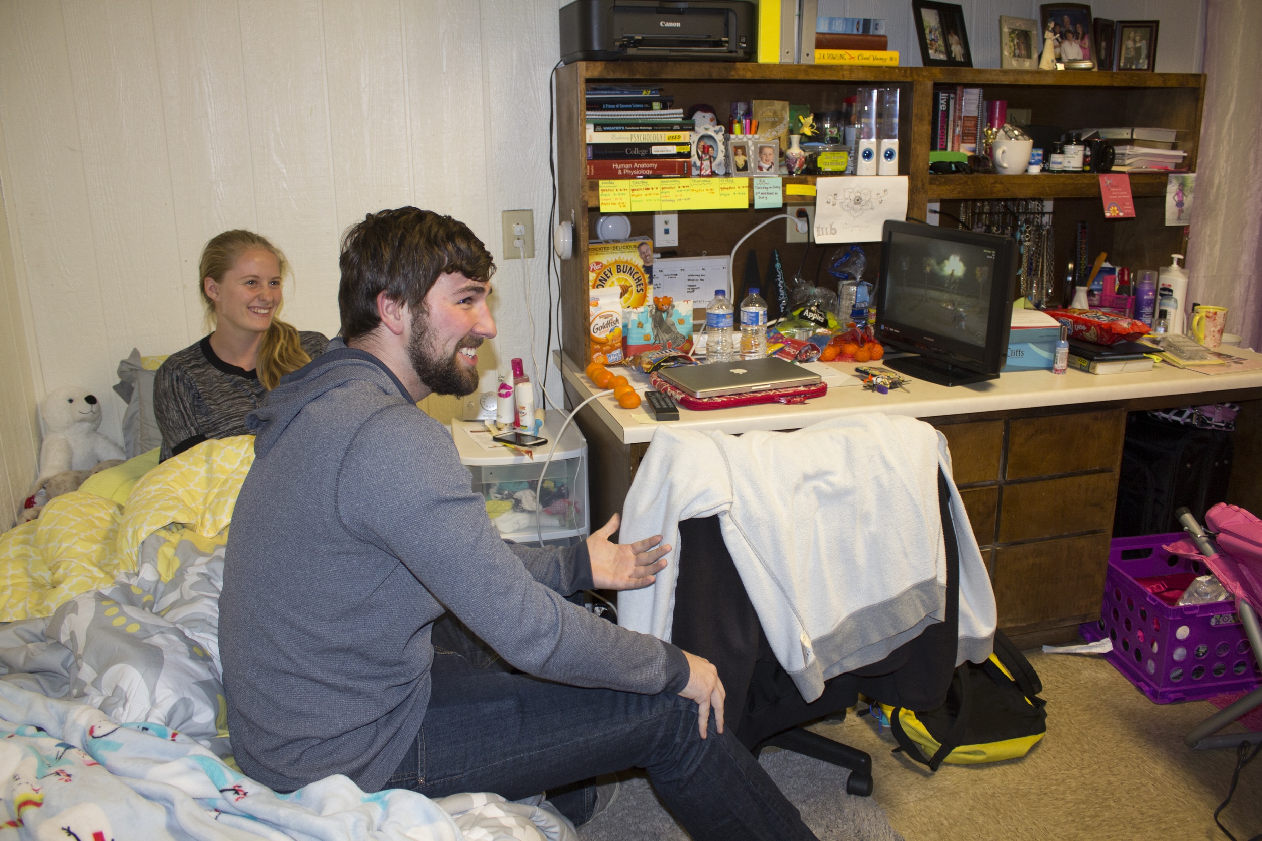  Garret King and McKenzie Botts settle down for a night of TV shows such as the Amazing Race. 