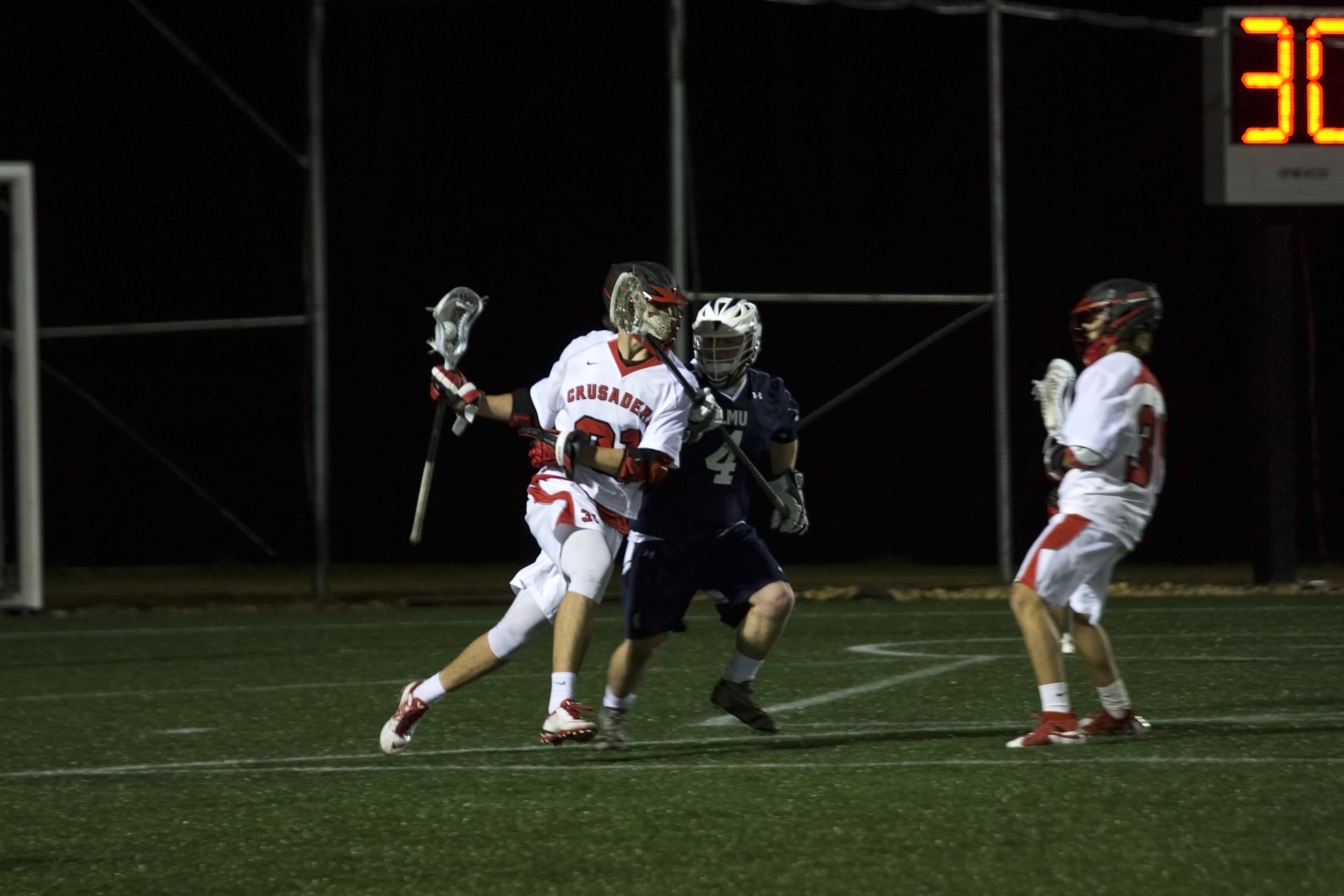  Carpenter takes a blow to the face in order to protect the ball and continue his push downfield.&nbsp; 