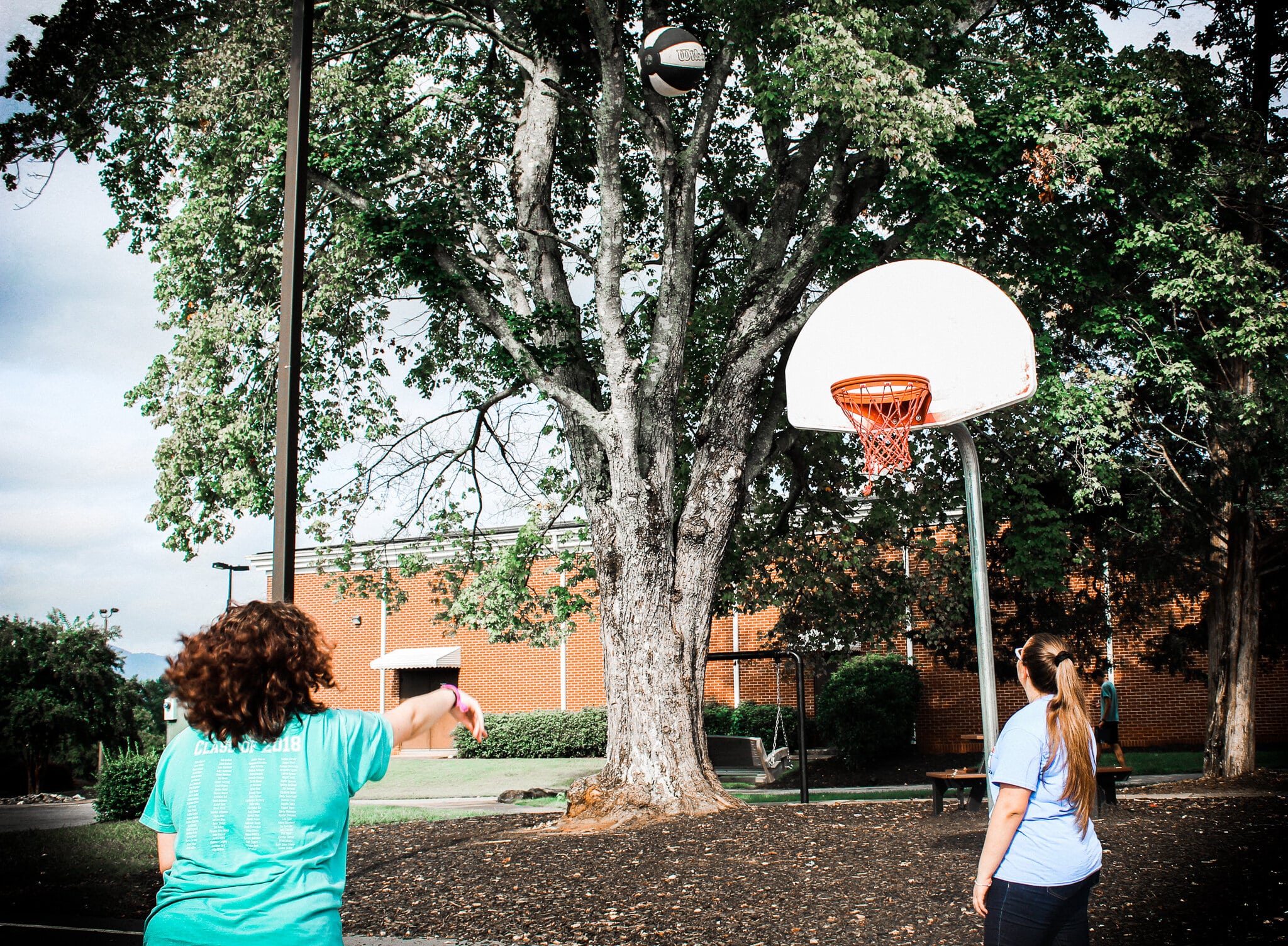 Elizabeth Davis, Interdisciplinary major and Amanda Montjoy, Health Science major, play basketball.