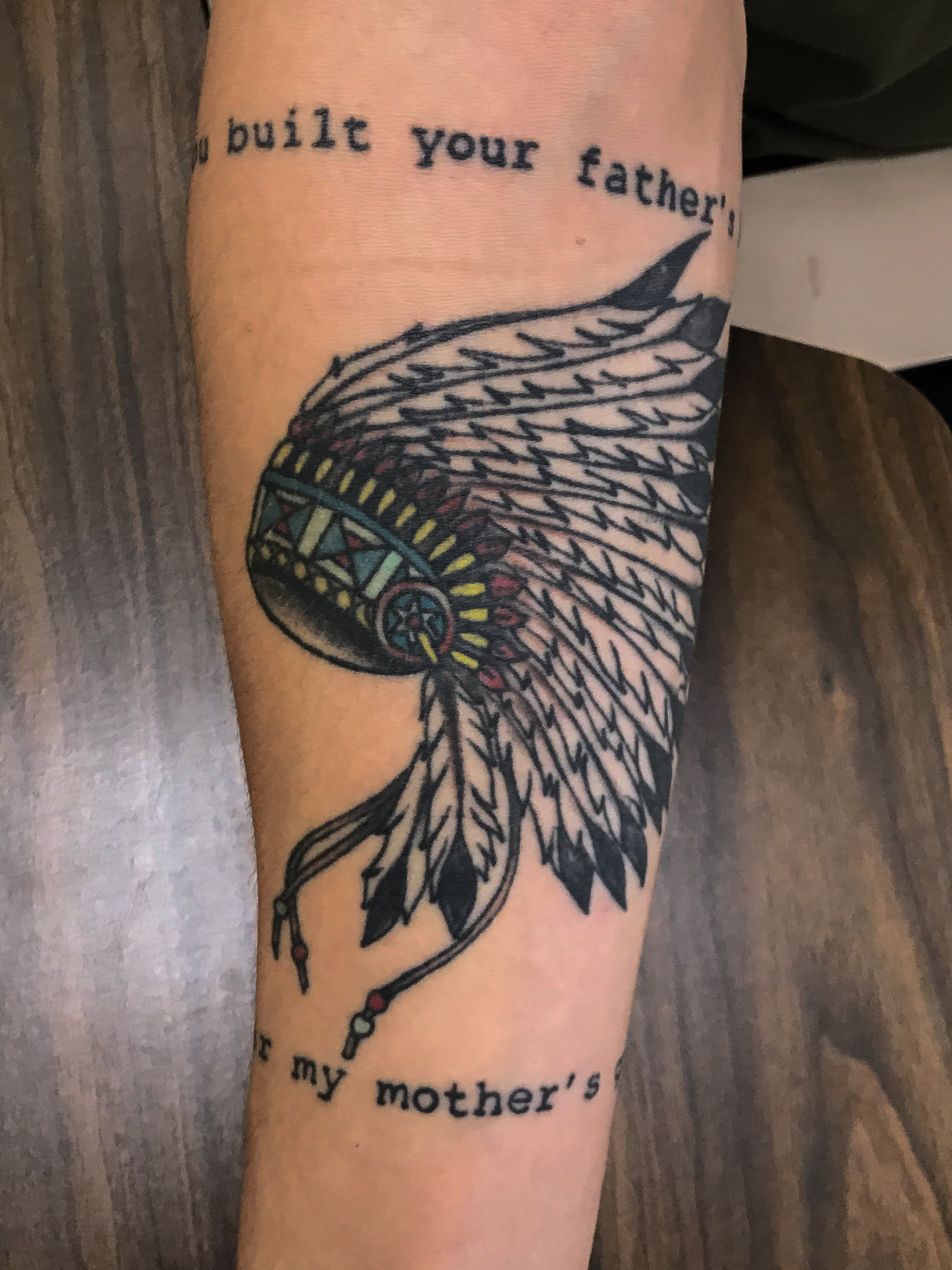 This is Ethan Clarks tattoo on his right forearm. The writing is lyrics that say, You built your fathers tomb on my mothers grave. Clark got this tattoo to represent Manifest Destiny during Westward Expansion. Being a member of the army, this w