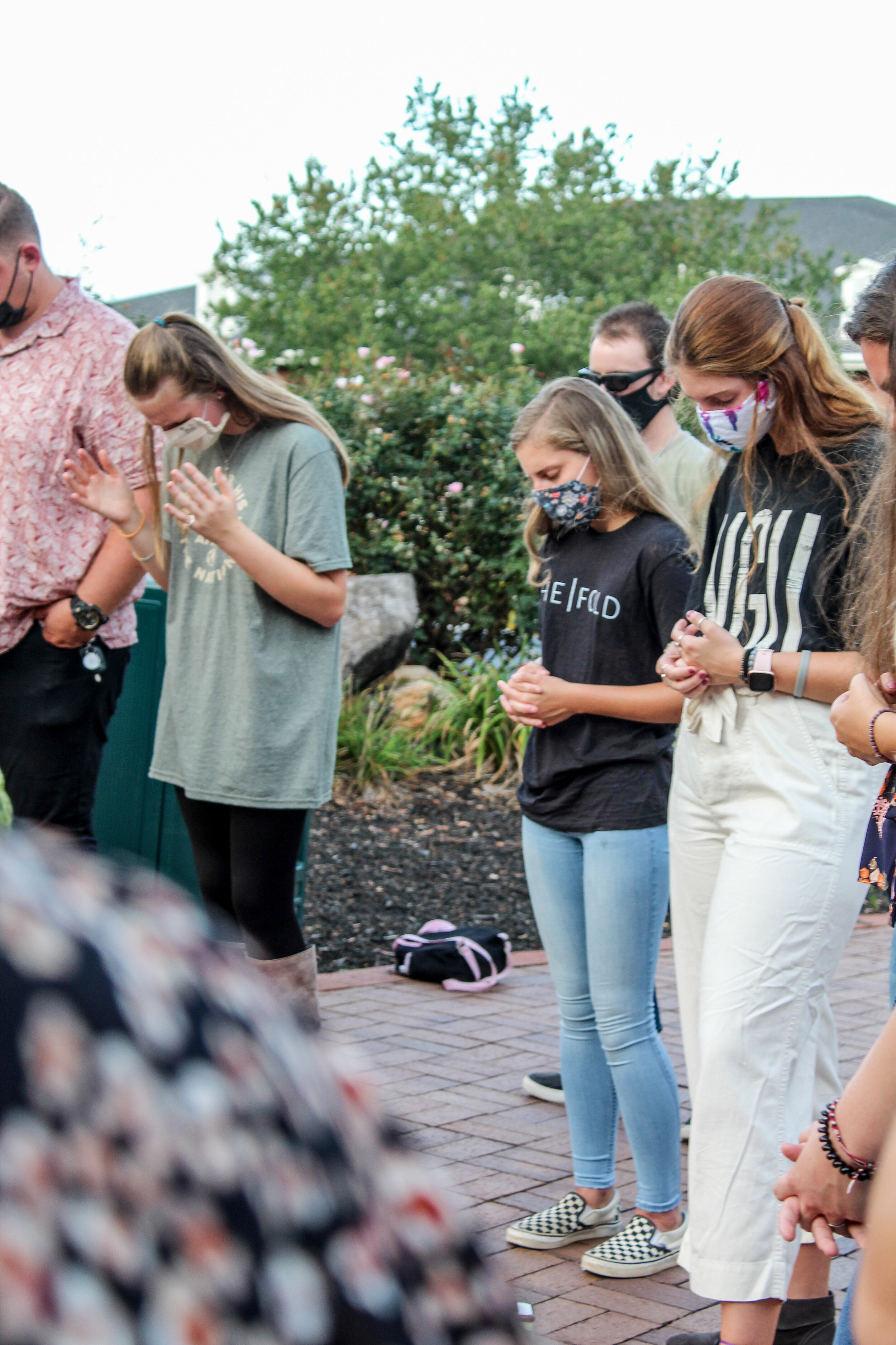 Some North Greenville students praying outside of Turner Chapel for the BCM service.