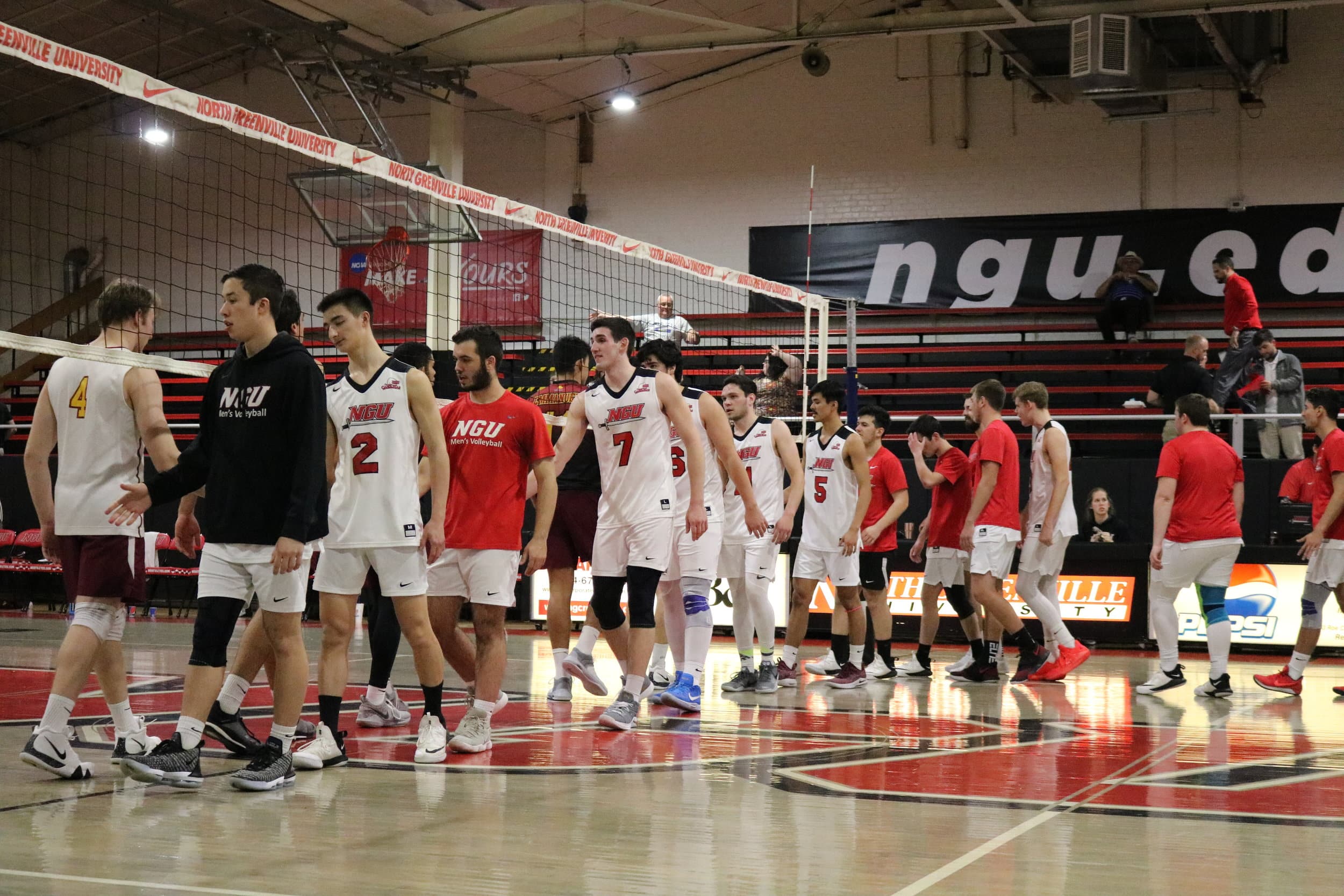 The Crusaders shake hands with the Lions after they defeated the Lions 25-21 in the third and final set.