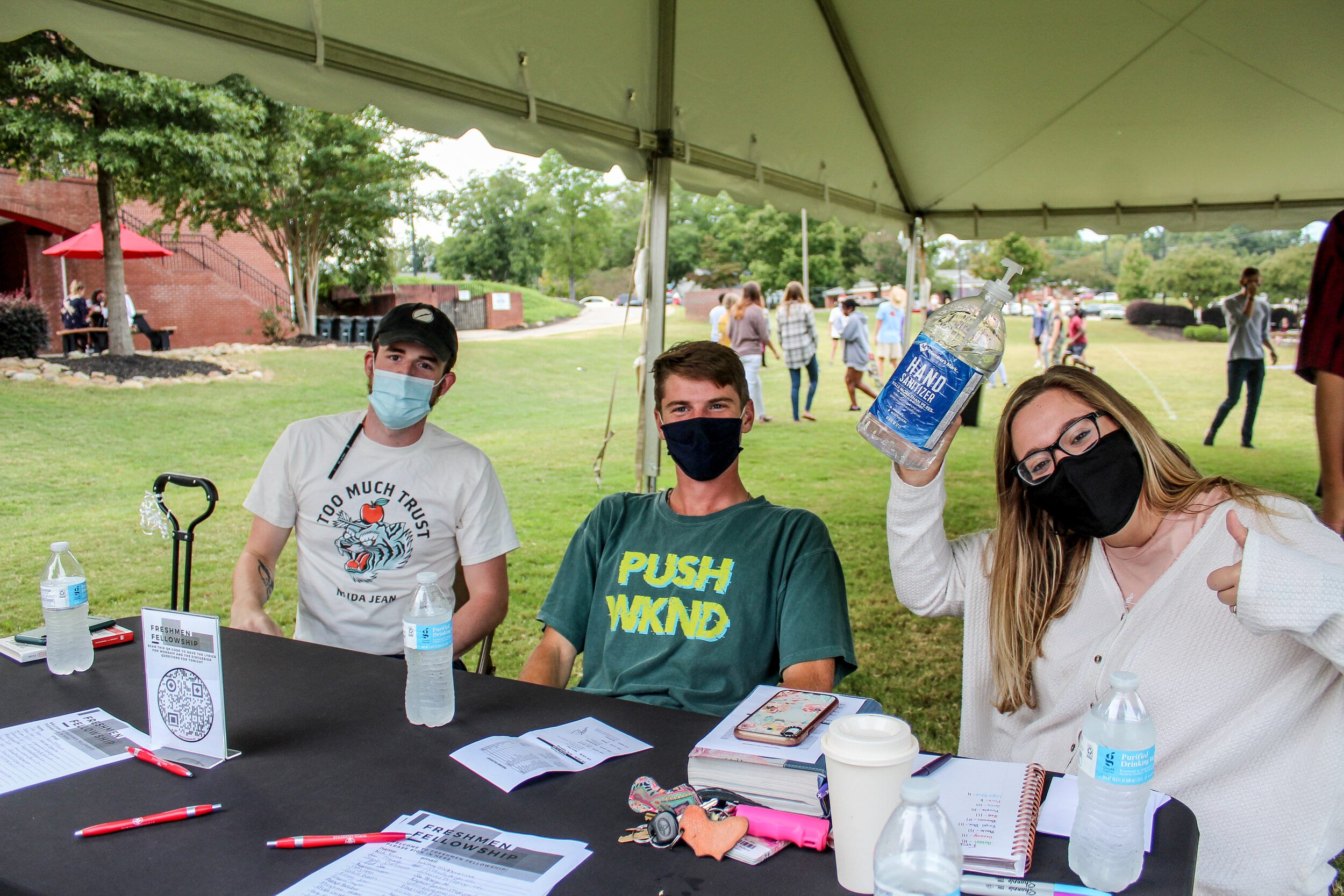From left to right: Senior Brayden Smith, junior Drew Reynolds and senior Nicole Pollard working the sign-in table for the freshman fellowship event.