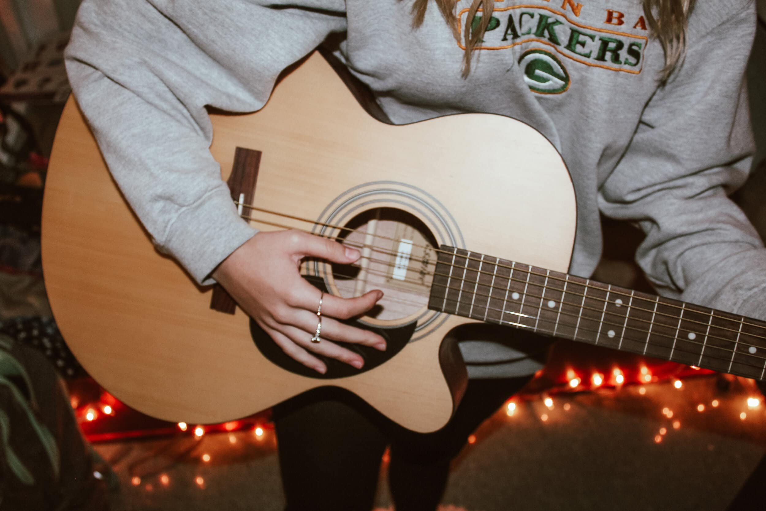 In quarantine, many creatives are taking this time to grow in their skillset. In this photo, a student is practicing guitar.