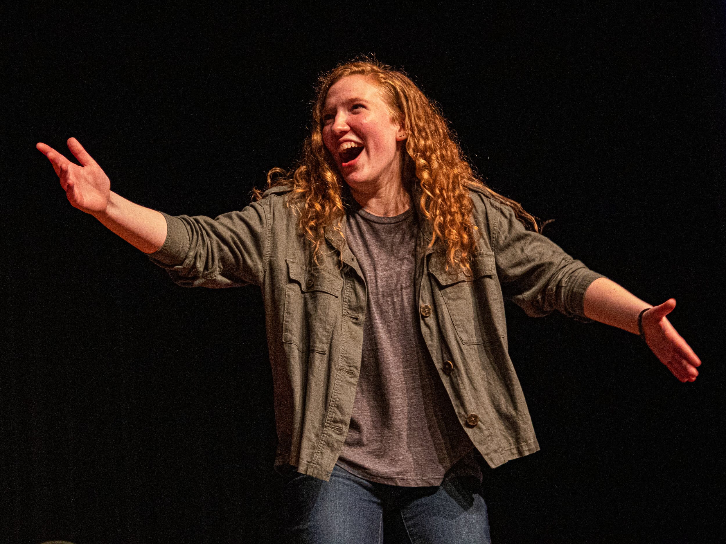 Junior Co-caption Lydia Kytle poses during one of the improv games, freeze.