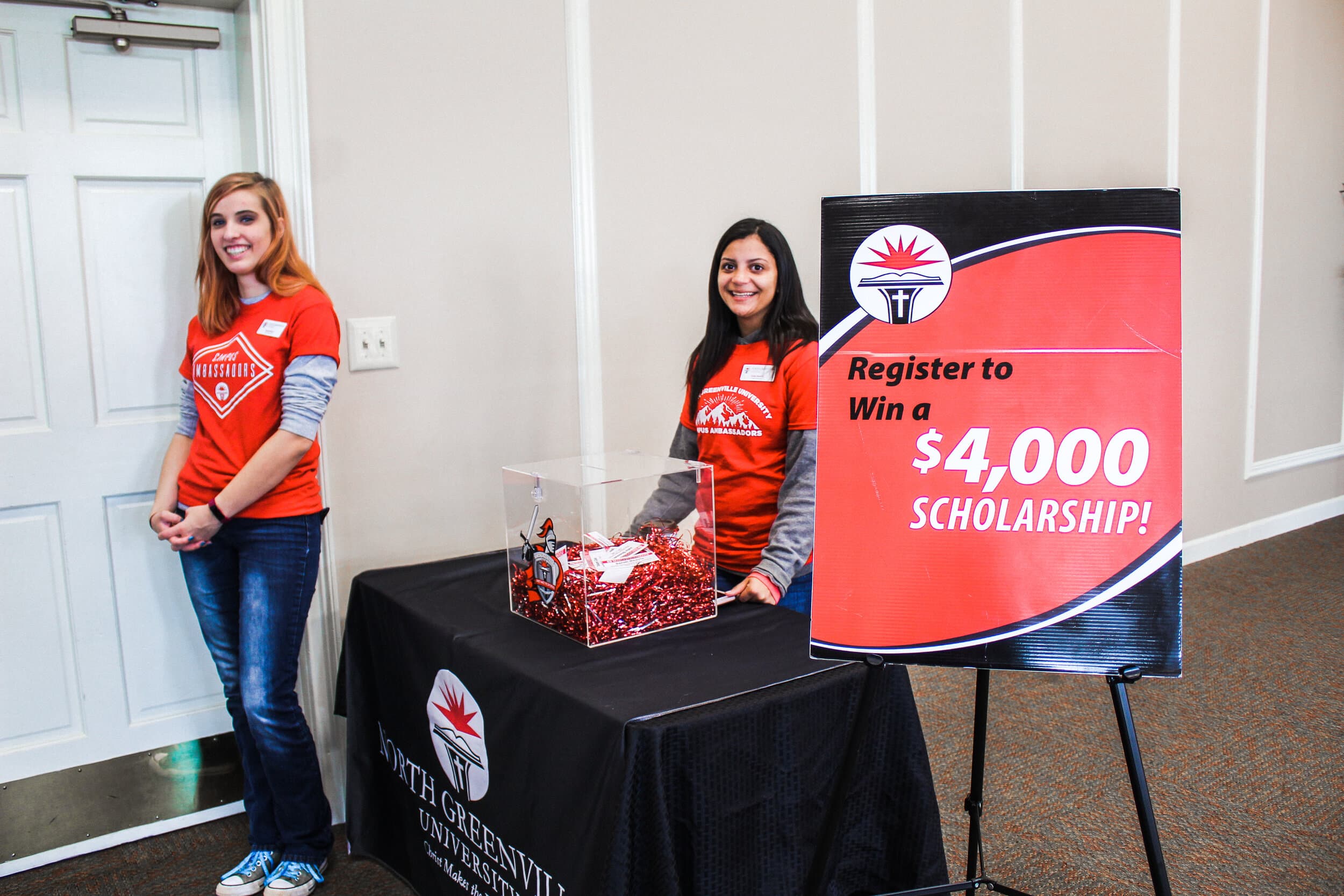 Sarah Dover and Aisha Burrell (freshmen) working the scholarship box at Open House registration.