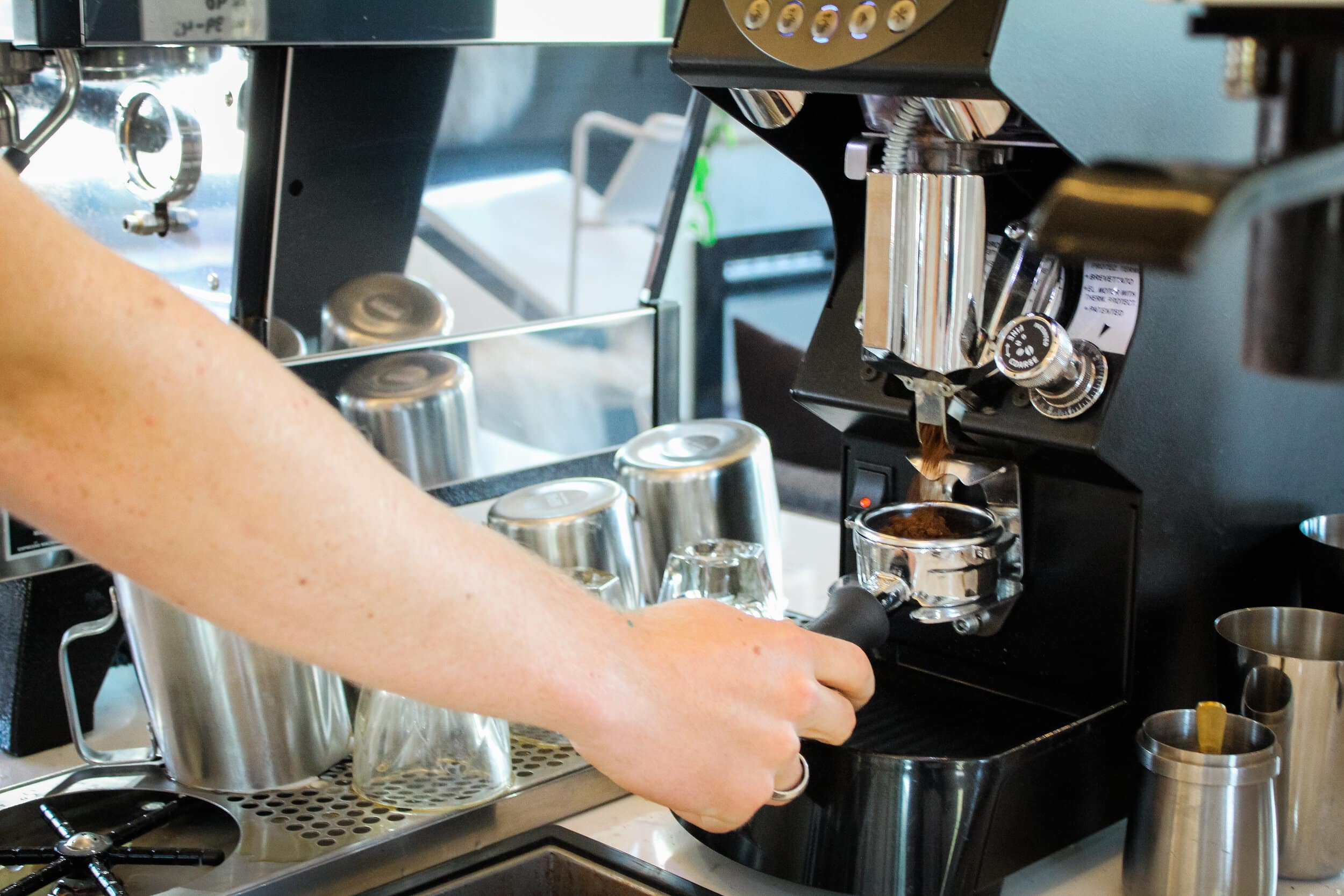 To begin making a cappuccino, the barista must prepare the espresso.