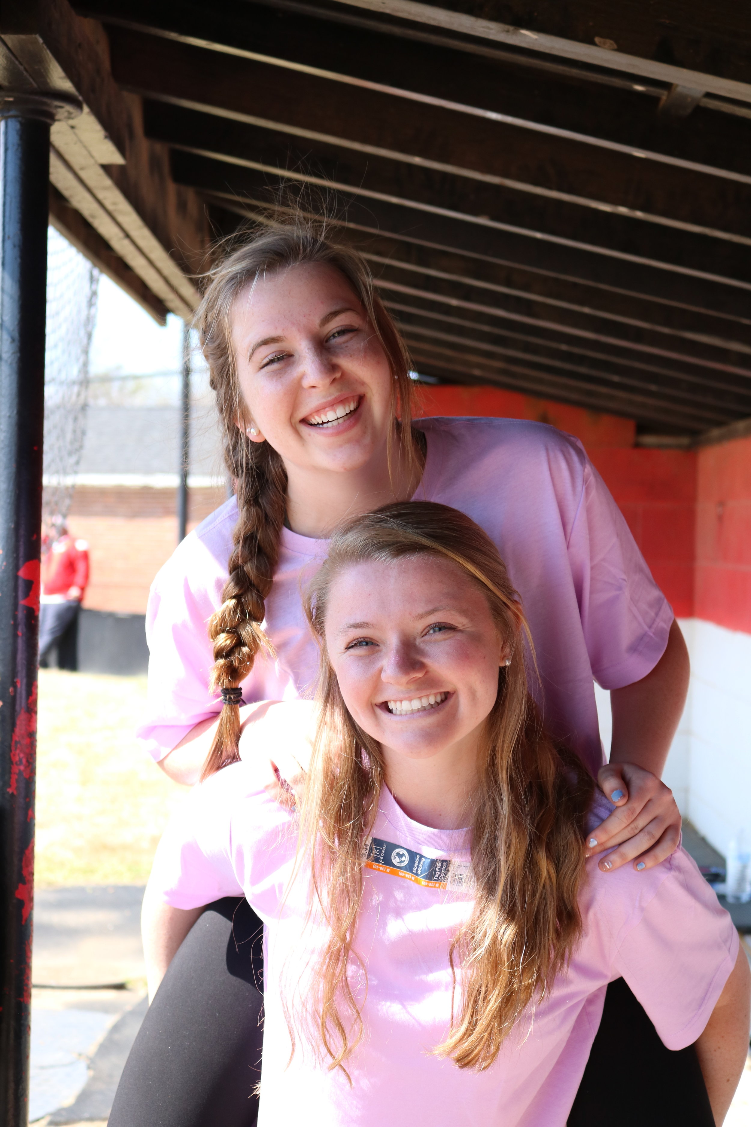 Freshman Kaitlinn Harrison and Senior Abby Malcom celebrate their win against BATsheba.