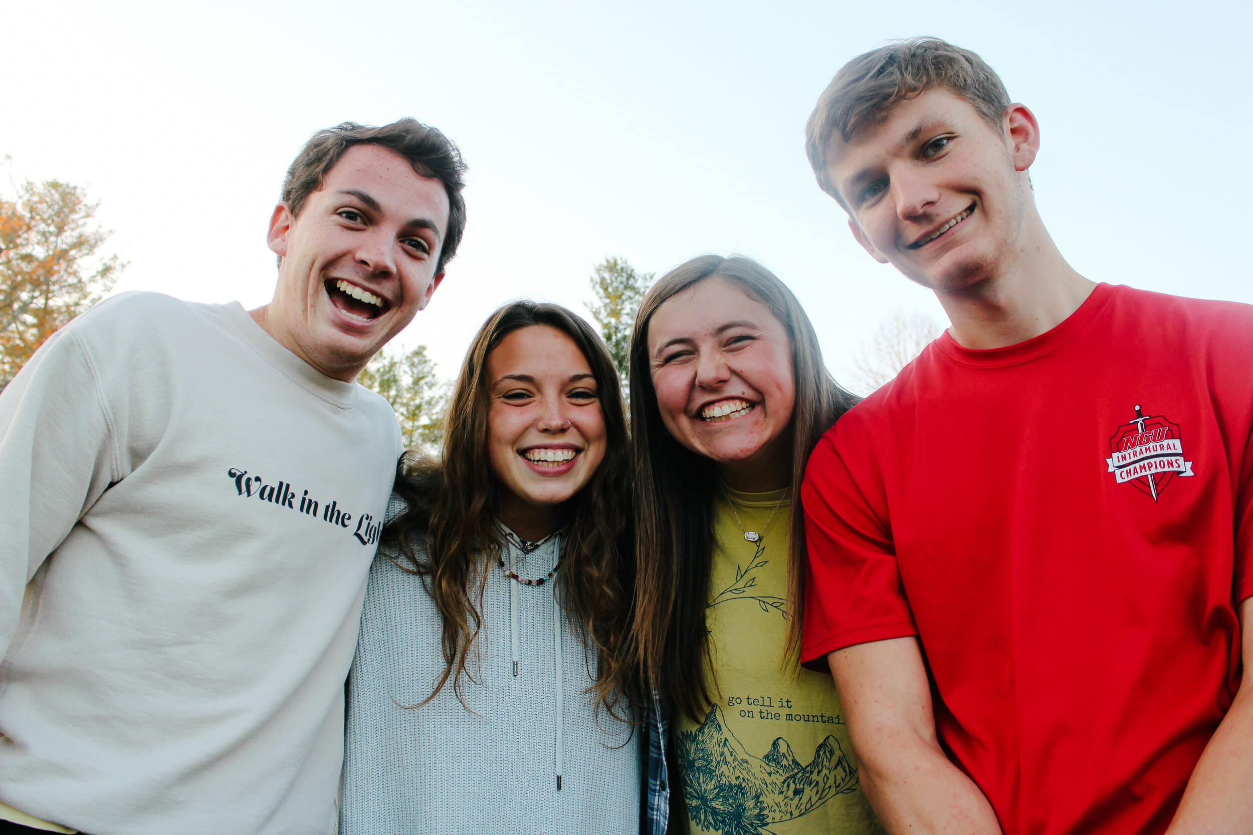 (From Left to Right) Sophomore Tyler Hudson, junior Levie Land, sophomore Chely Dickert and sophomore Noah Smith smile big as they are hanging out with students at the D-Now weekend.