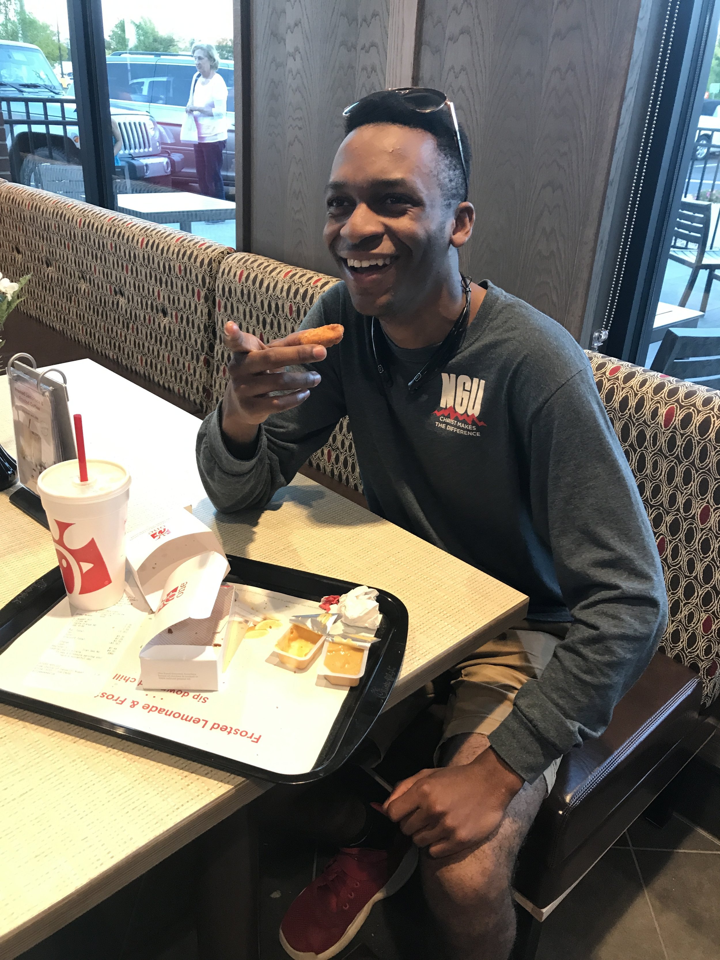 D.J. Hillson (freshman) joyfully devours his meal.