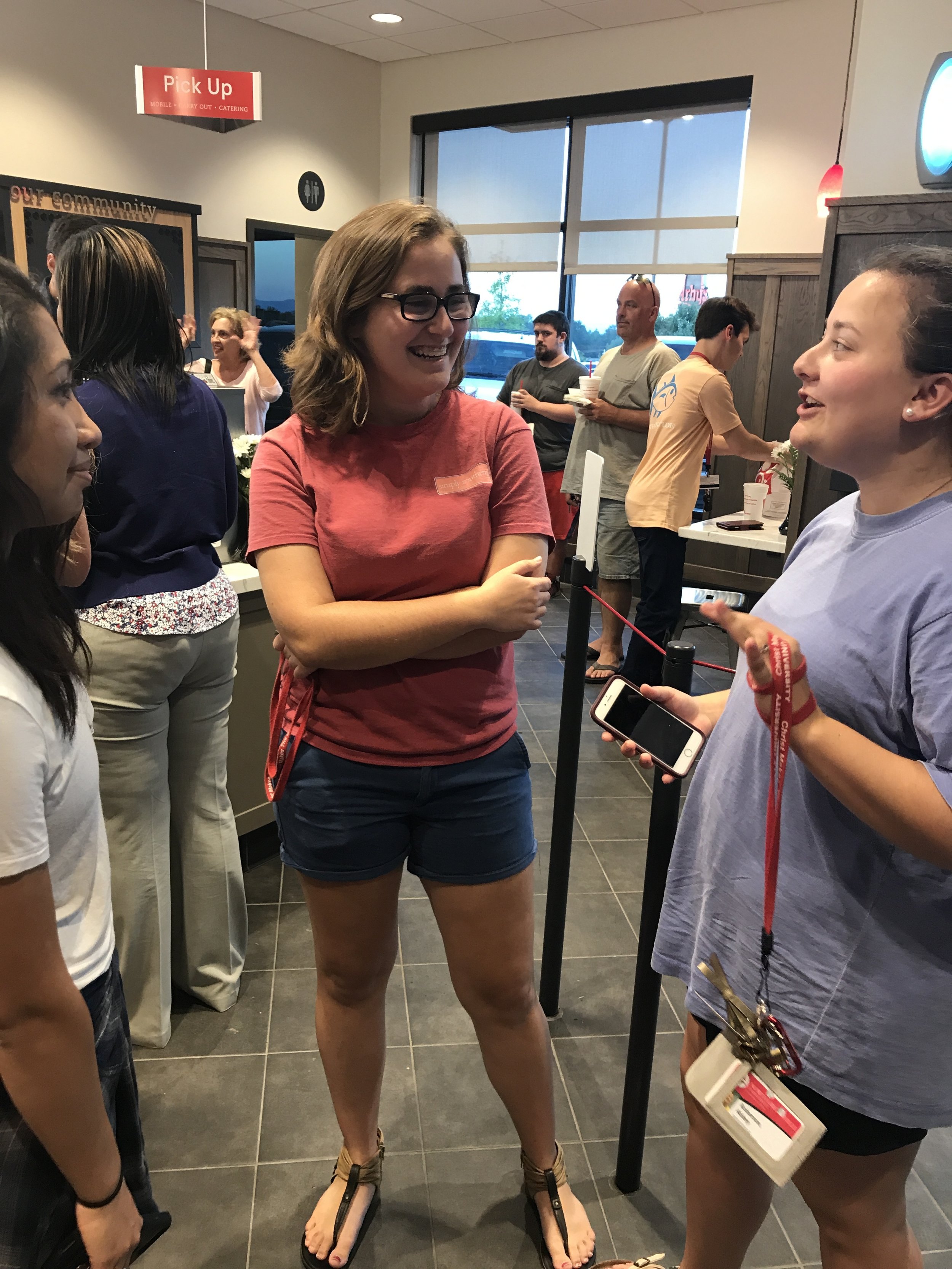Paola Martz (freshman), Marissa Holst (freshman)&nbsp;and Abbey Roberson (freshman) eagerly wait in line to order at the brand newChick-fil-A.