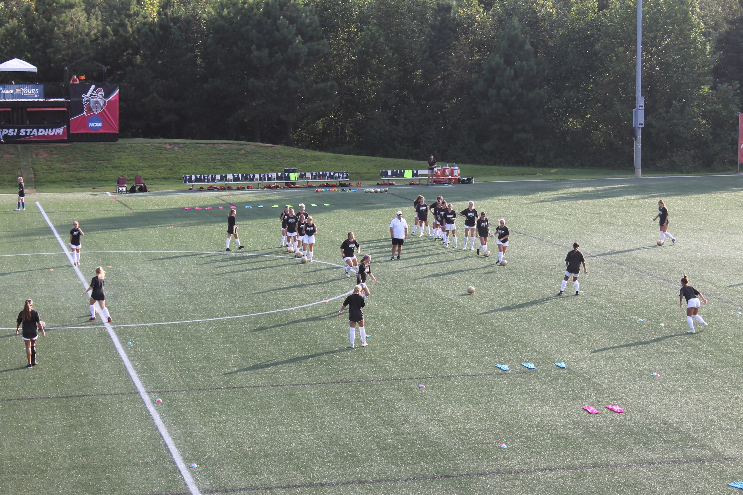 NGU ladies soccer team warming up before the game; preparing to play against Lander University.