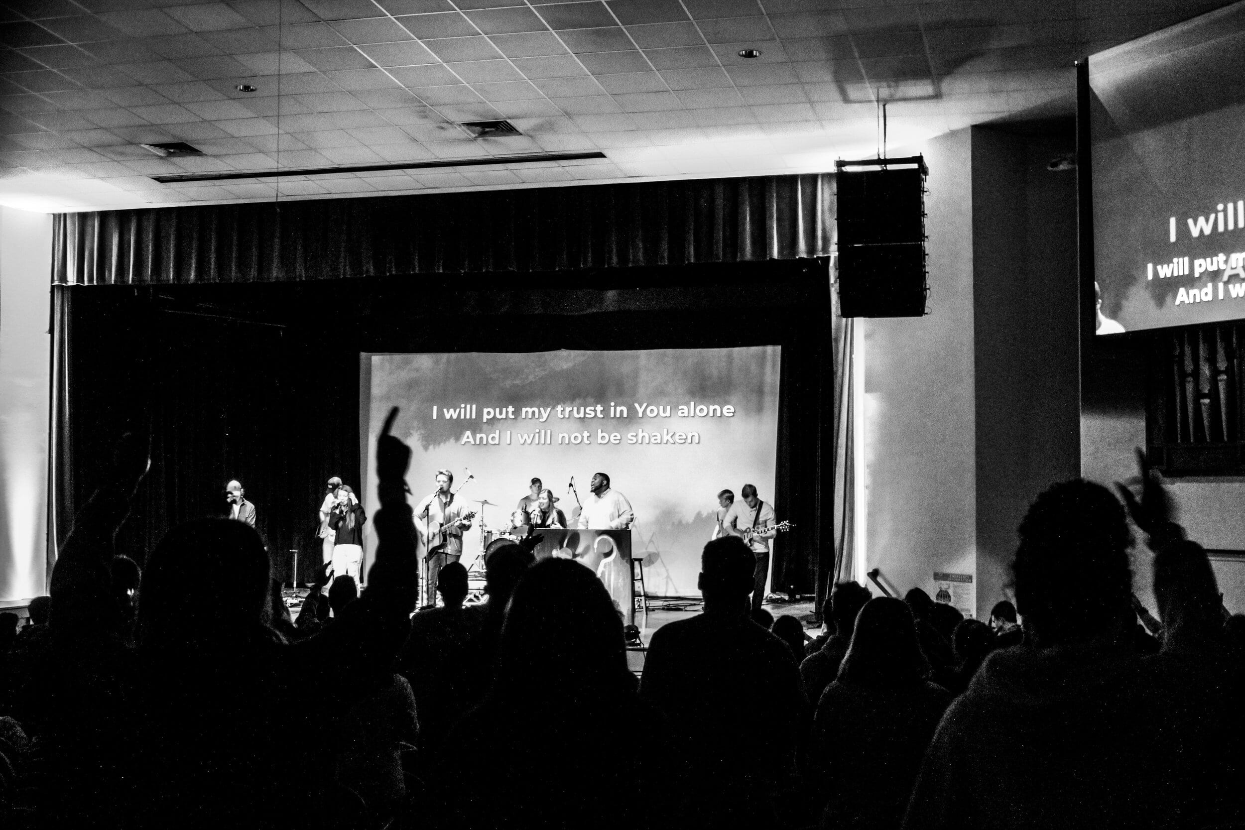 Students singing Build My Life as the band is leading.