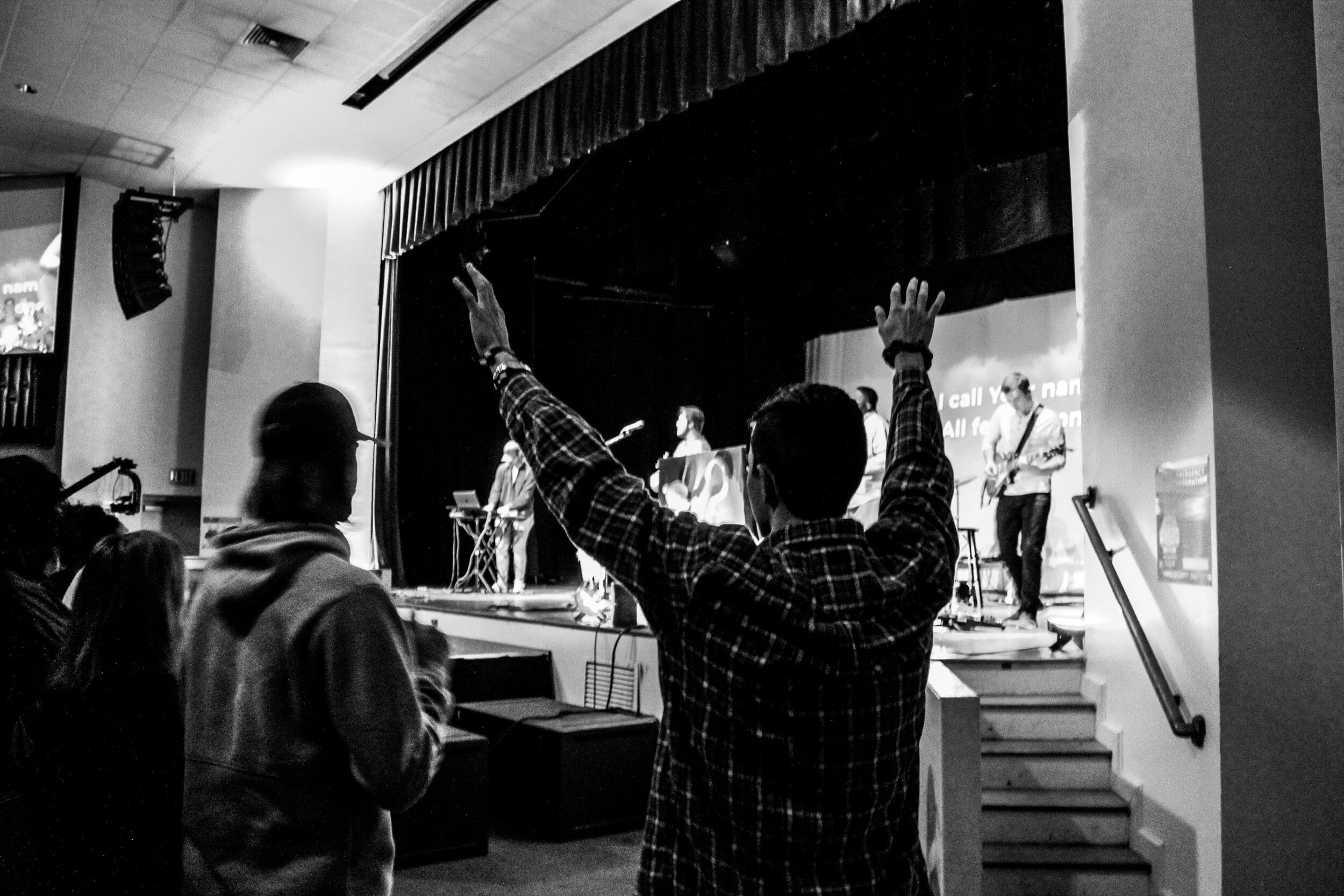 Joey Noyes worshipping with hands lifted.