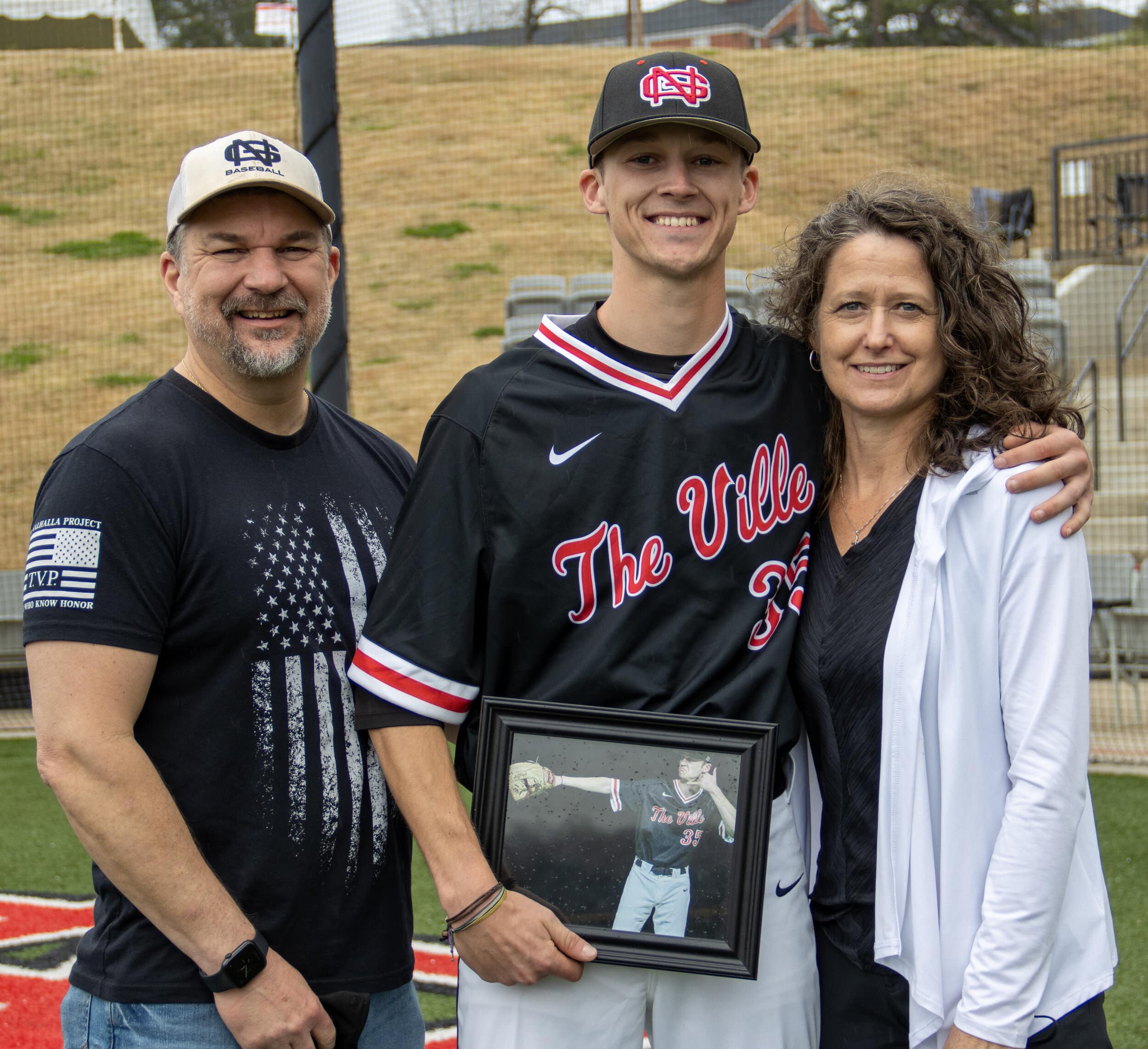 Pitcher Matthew Dailey, known as Dimes by his teammates, poses after the senior day ceremony.