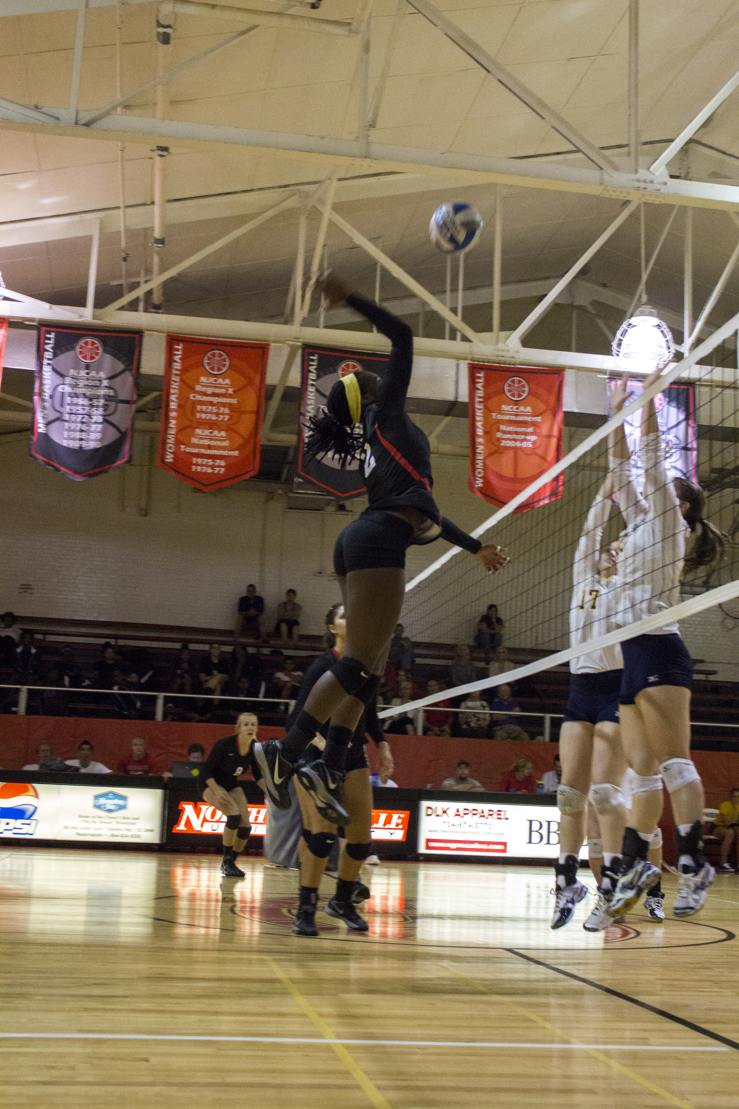  Junior Yomi Adeyeye jumps up to deliver a spike. 
