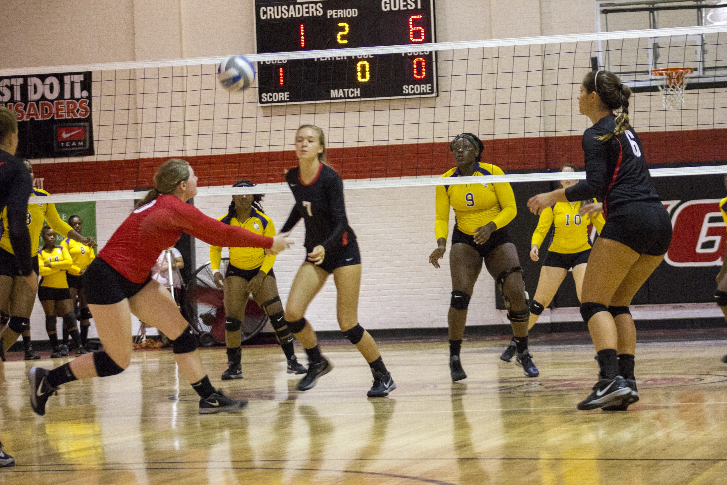  Junior Hannah Lewis bumps the ball to awaiting sophomore Haley Hester.&nbsp; 