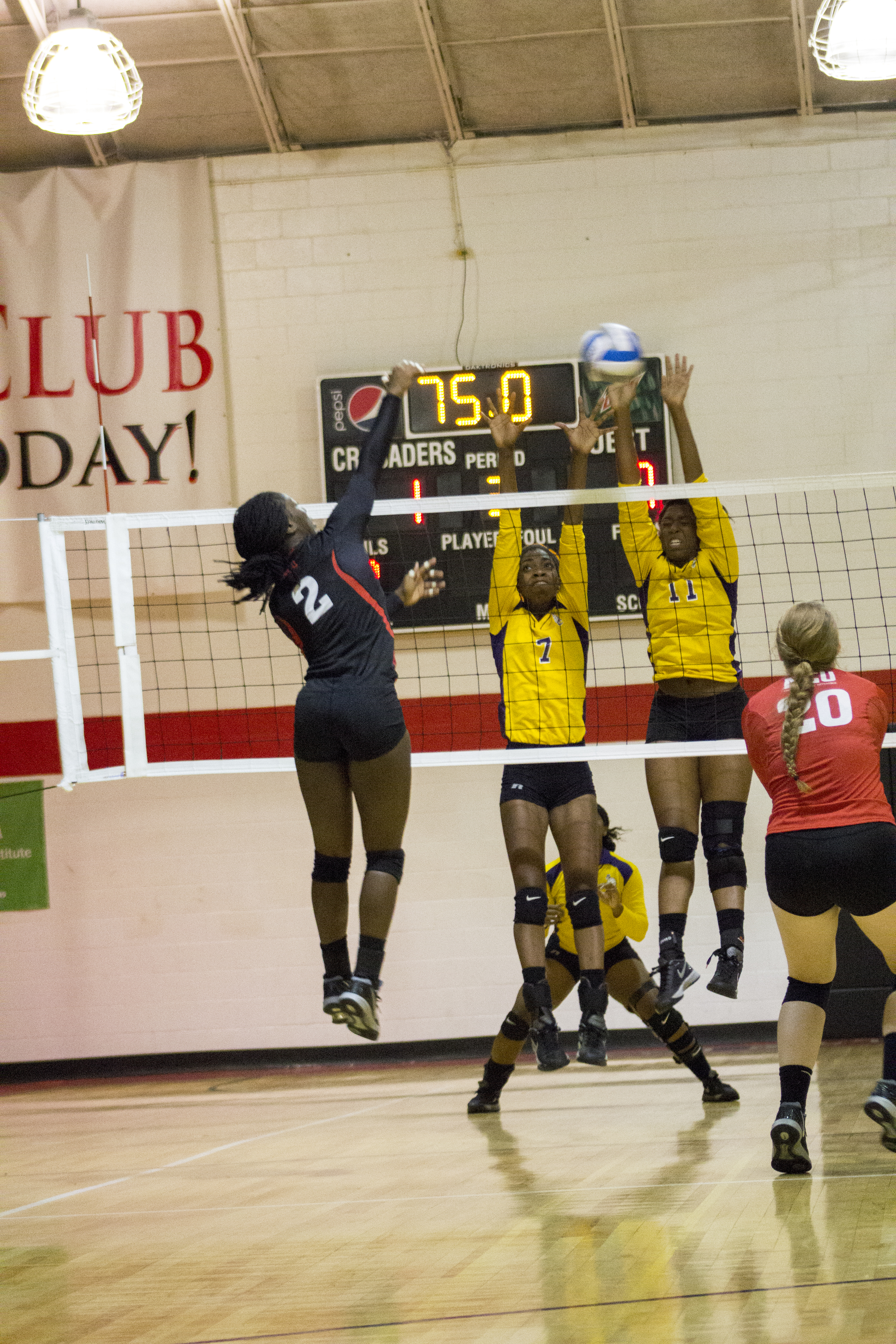  Junior Yomi Adeyeye spikes the ball at the opposing team.&nbsp; 