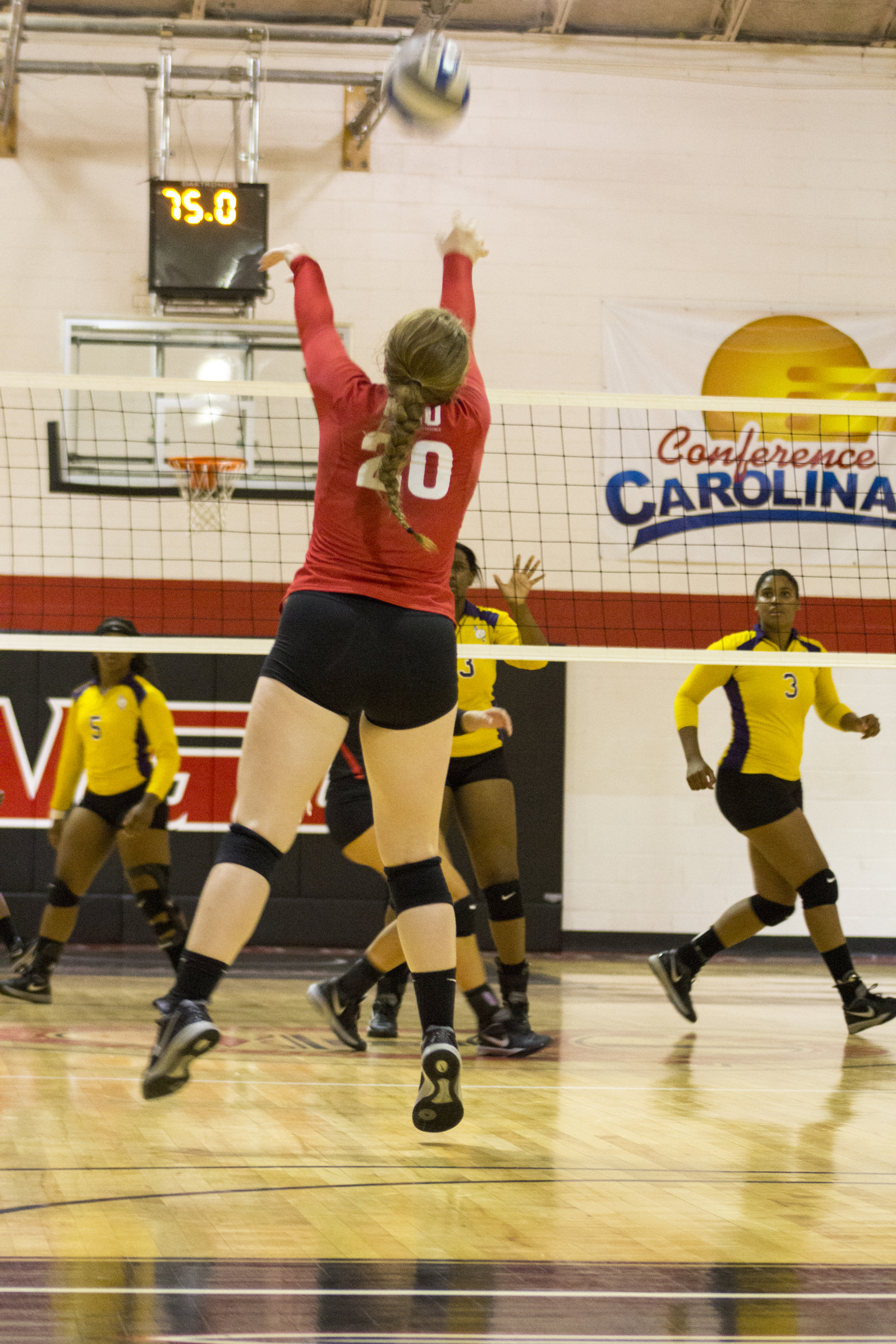  Junior Hannah Lewis jumps up to forward set the ball for her teammates.&nbsp; 