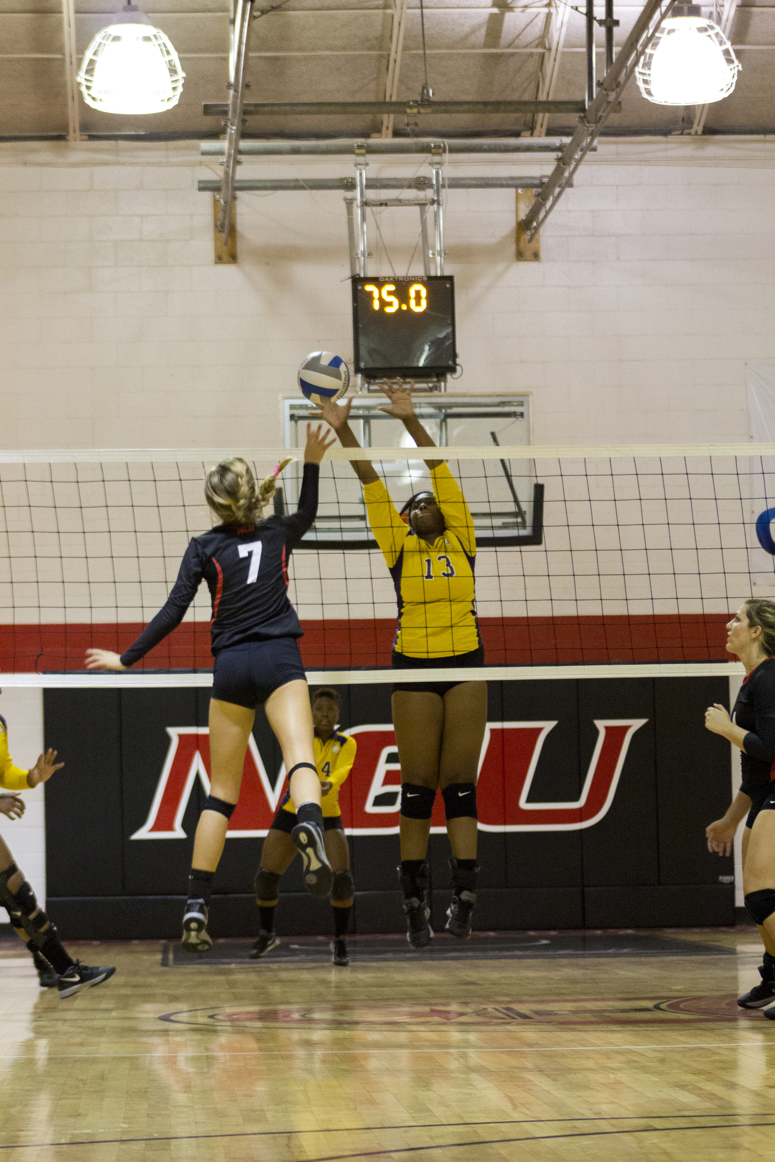  Sophomore Haley Hester dives forward to spike the ball. 