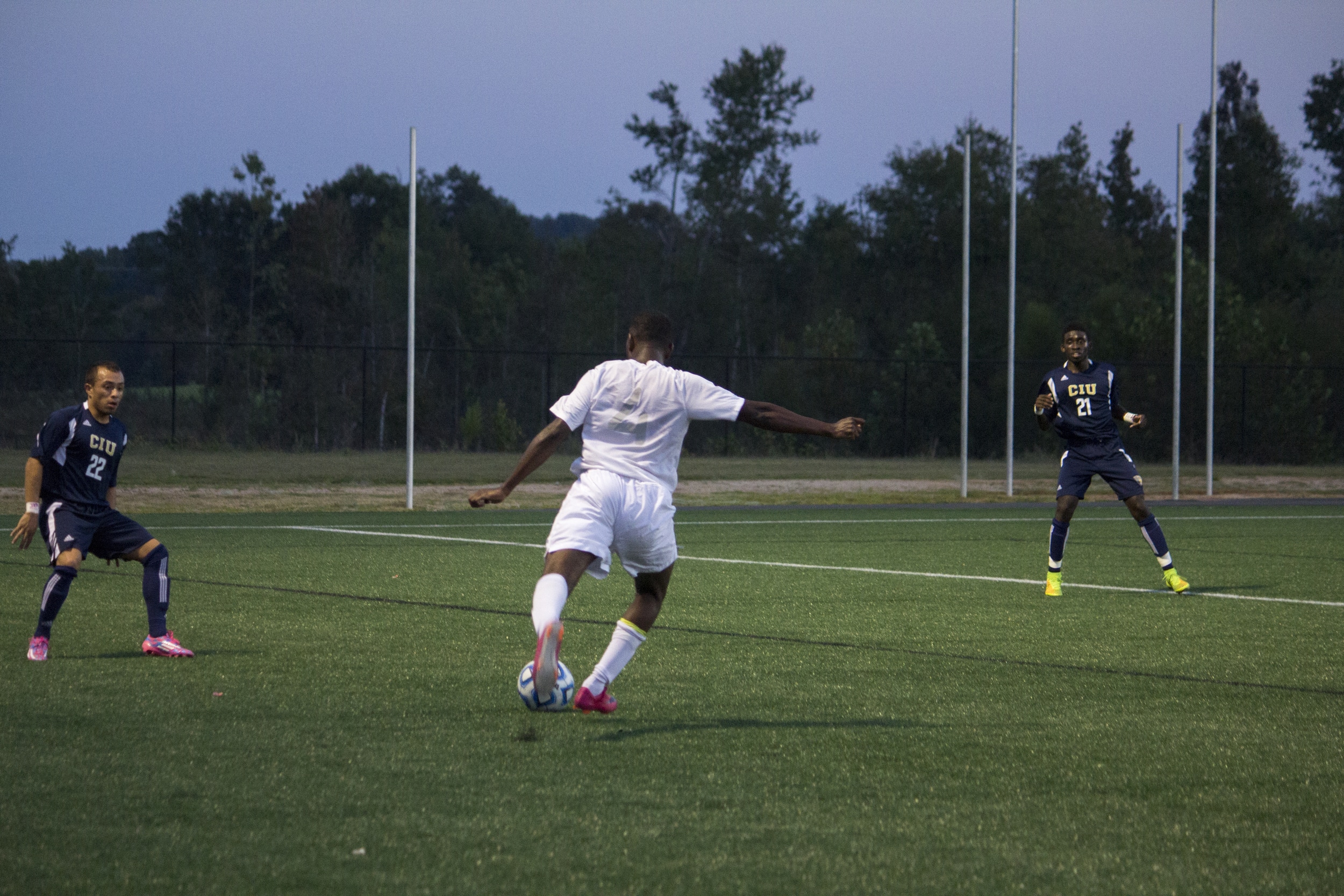  Shomari Bridgewater, junior, kicks the ball upfield to his teammates.&nbsp; 