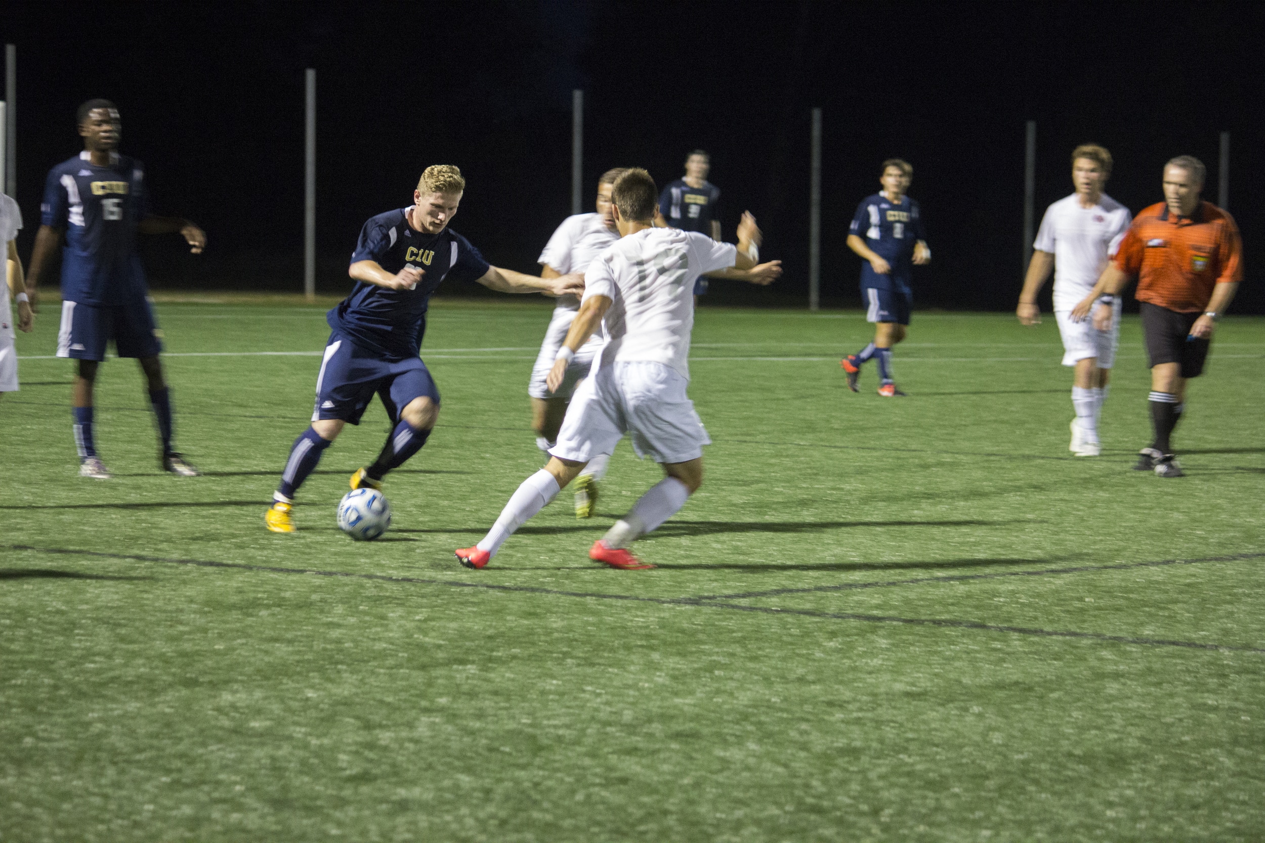  Junior Ara Zadoorian attempts to steal the ball from the rival Columbia International player.&nbsp; 