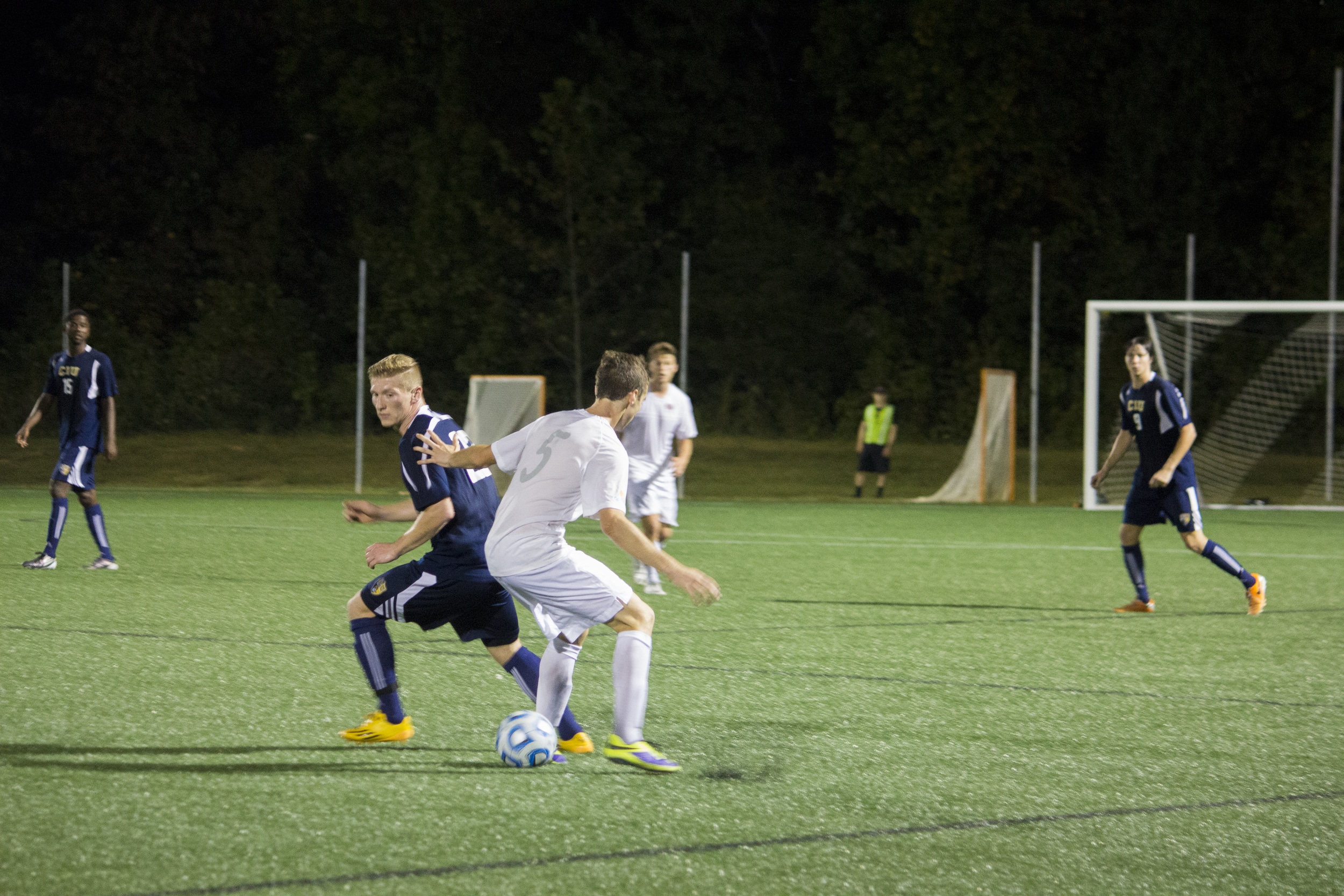  Freshman Victor Labi bodies up and pulls a trick on rival Columbian player.&nbsp; 