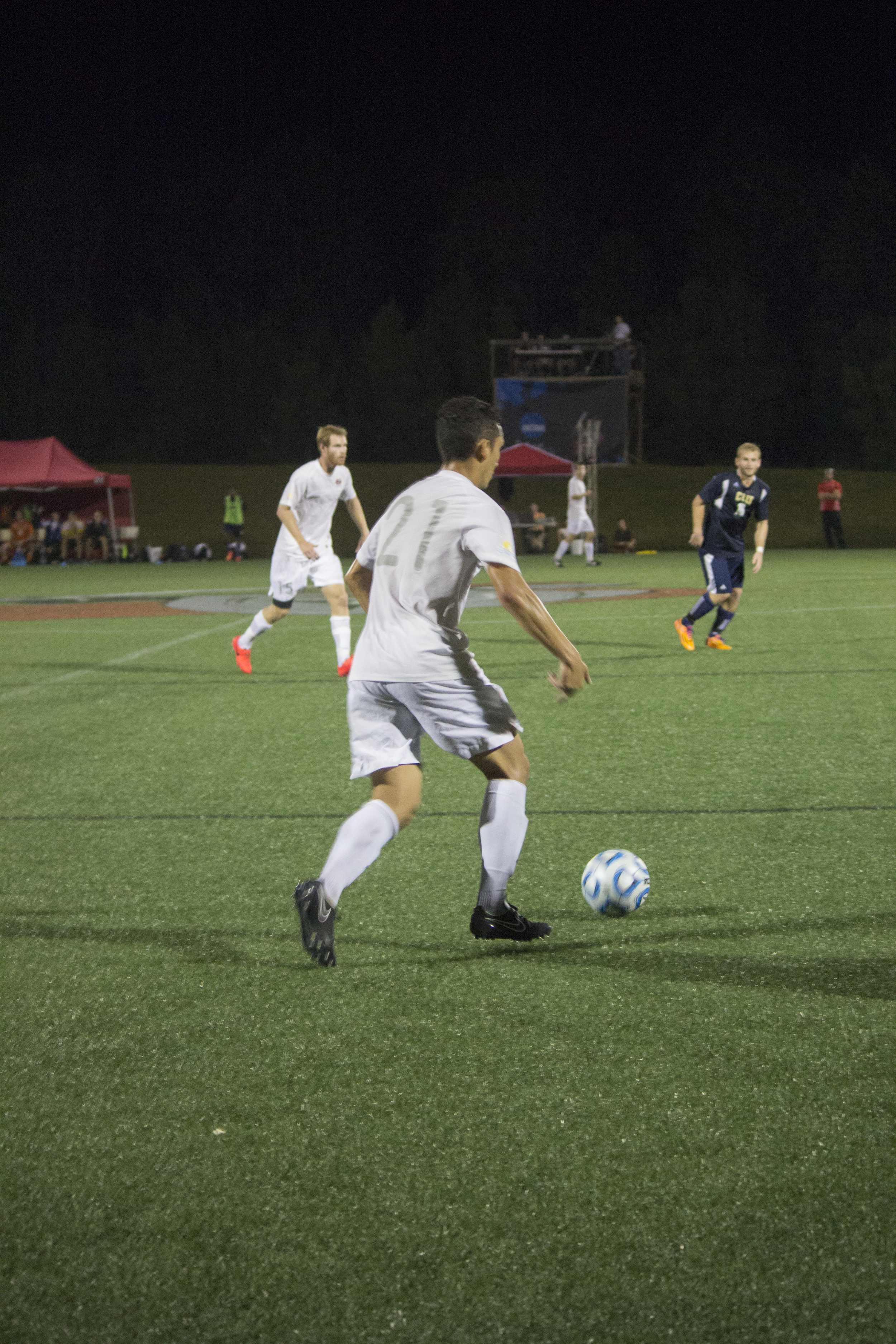  Senior Jonathan Arango dribbles the ball downfield.&nbsp; 