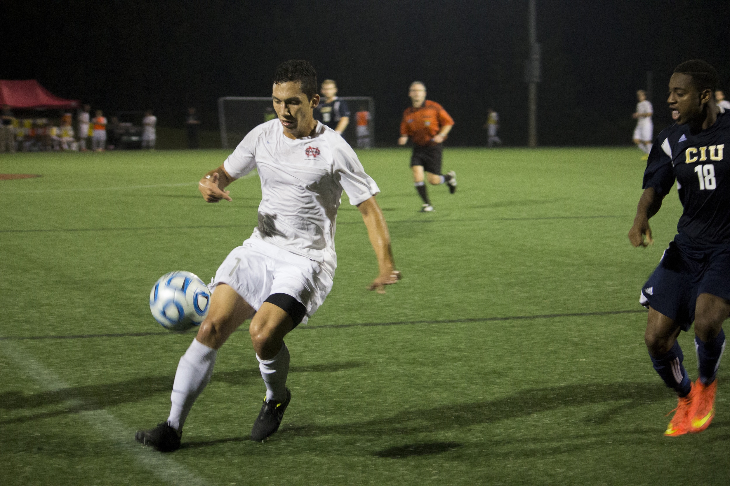  Senior Jonathan Arango sprints to the sidelines to keep the ball in play.&nbsp; 