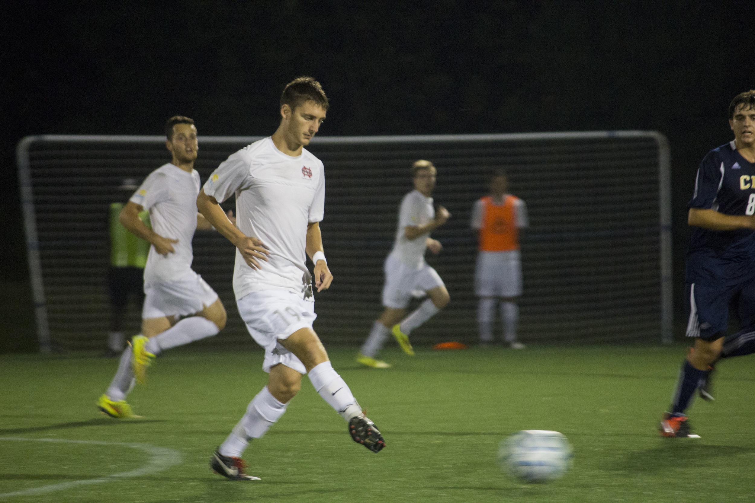  Junior Ara Zadoorian passes the ball to his teammate.&nbsp; 