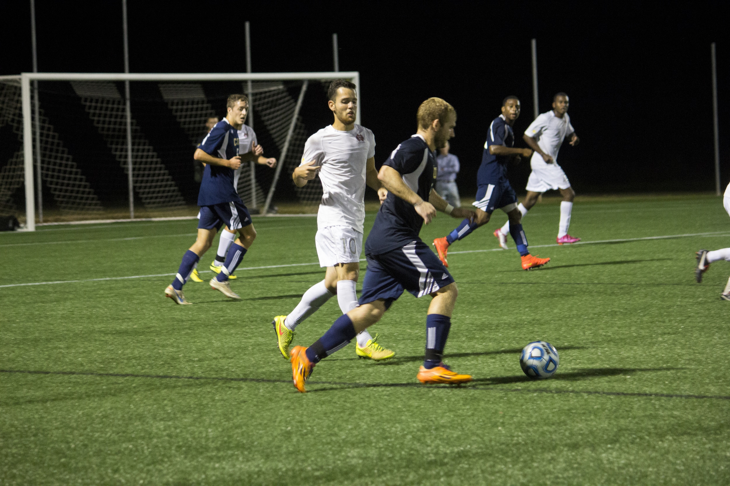  Junior Thales Wieczorek runs downfield to put pressure on the opposing Ram's player.&nbsp; 