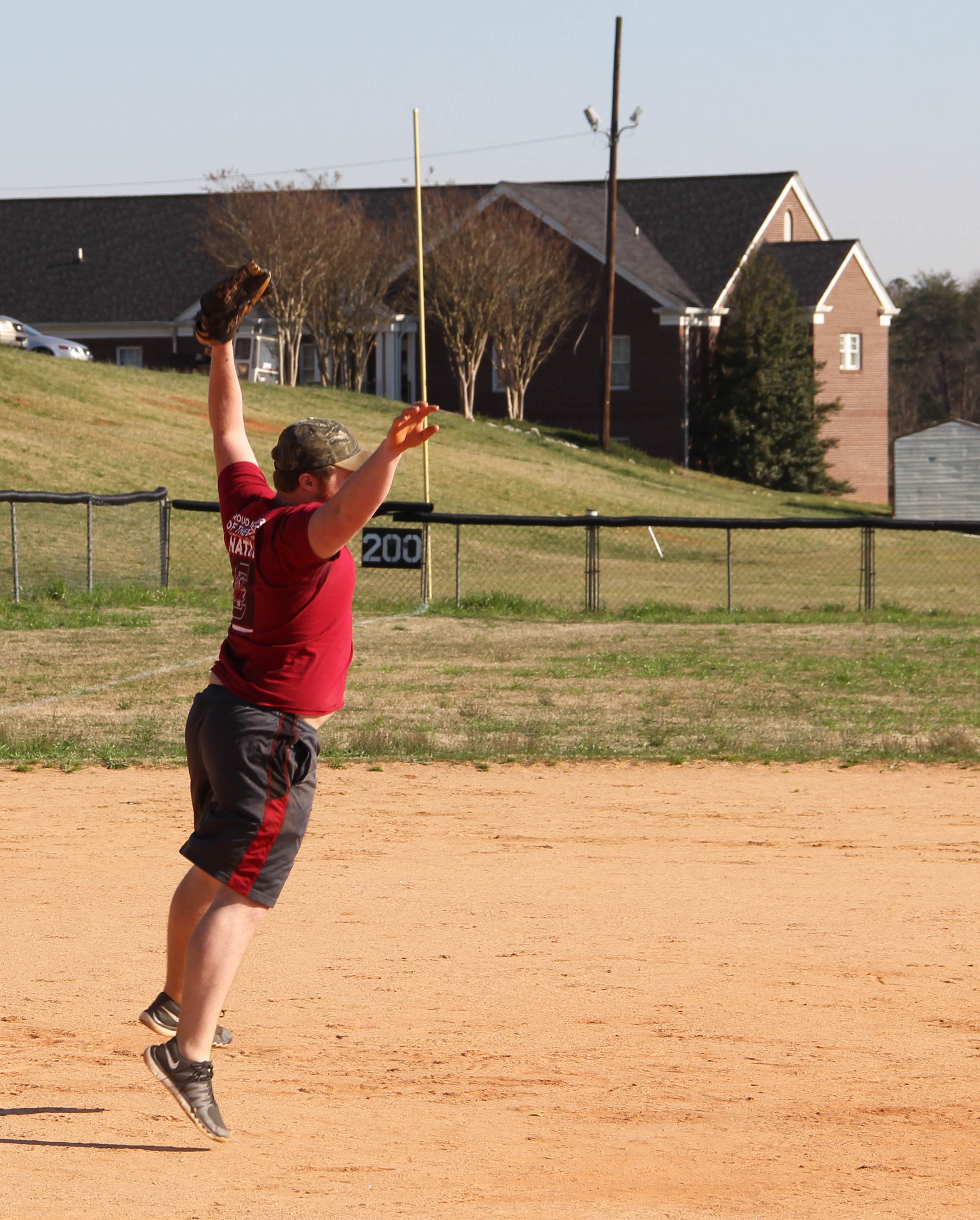  Seth Williams jumps to catch a ball from the outfield.&nbsp; 