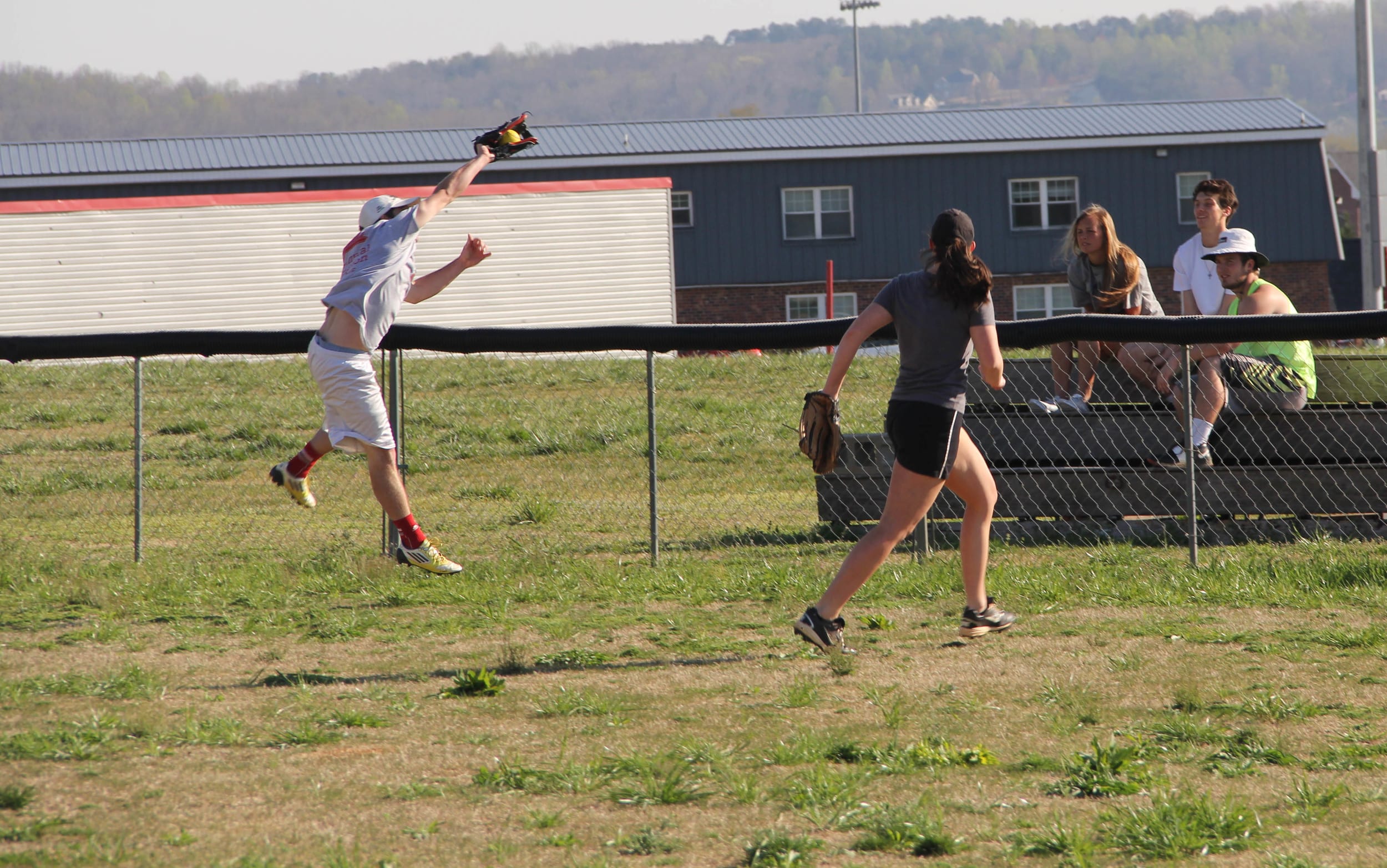  Bradley Hall leaps to catch a ball deep outfield.&nbsp; 