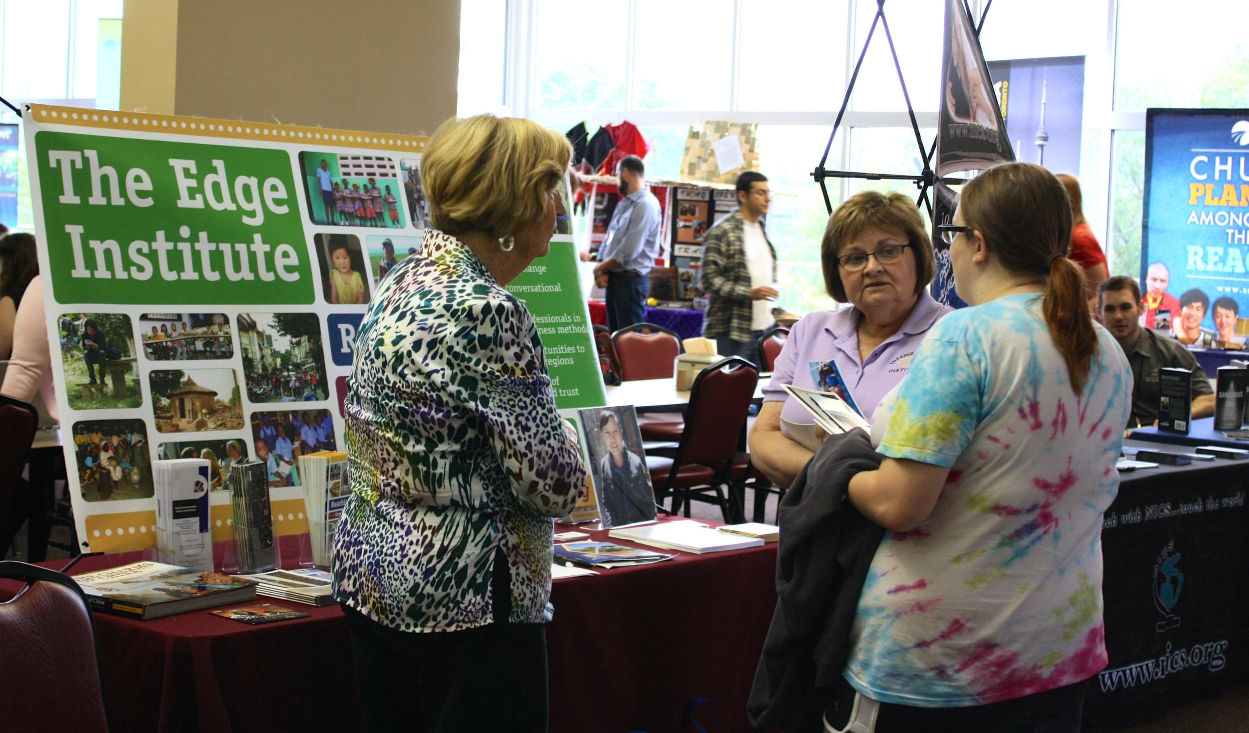  A student converses with missionaries in the cafeteria during NGU's global missions week September 8-10. 