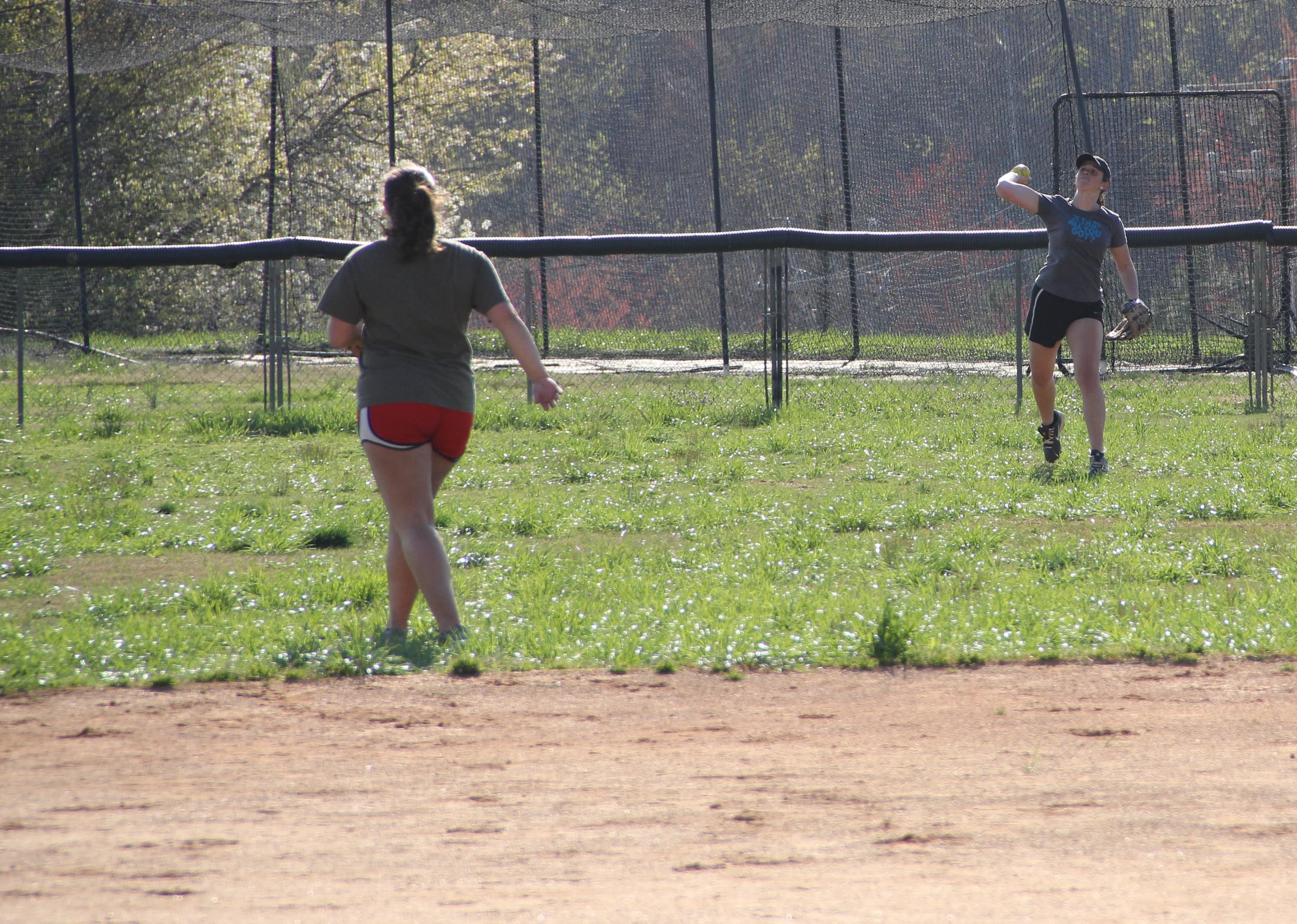  Misty Brockell throws a ball in from deep outfield. 