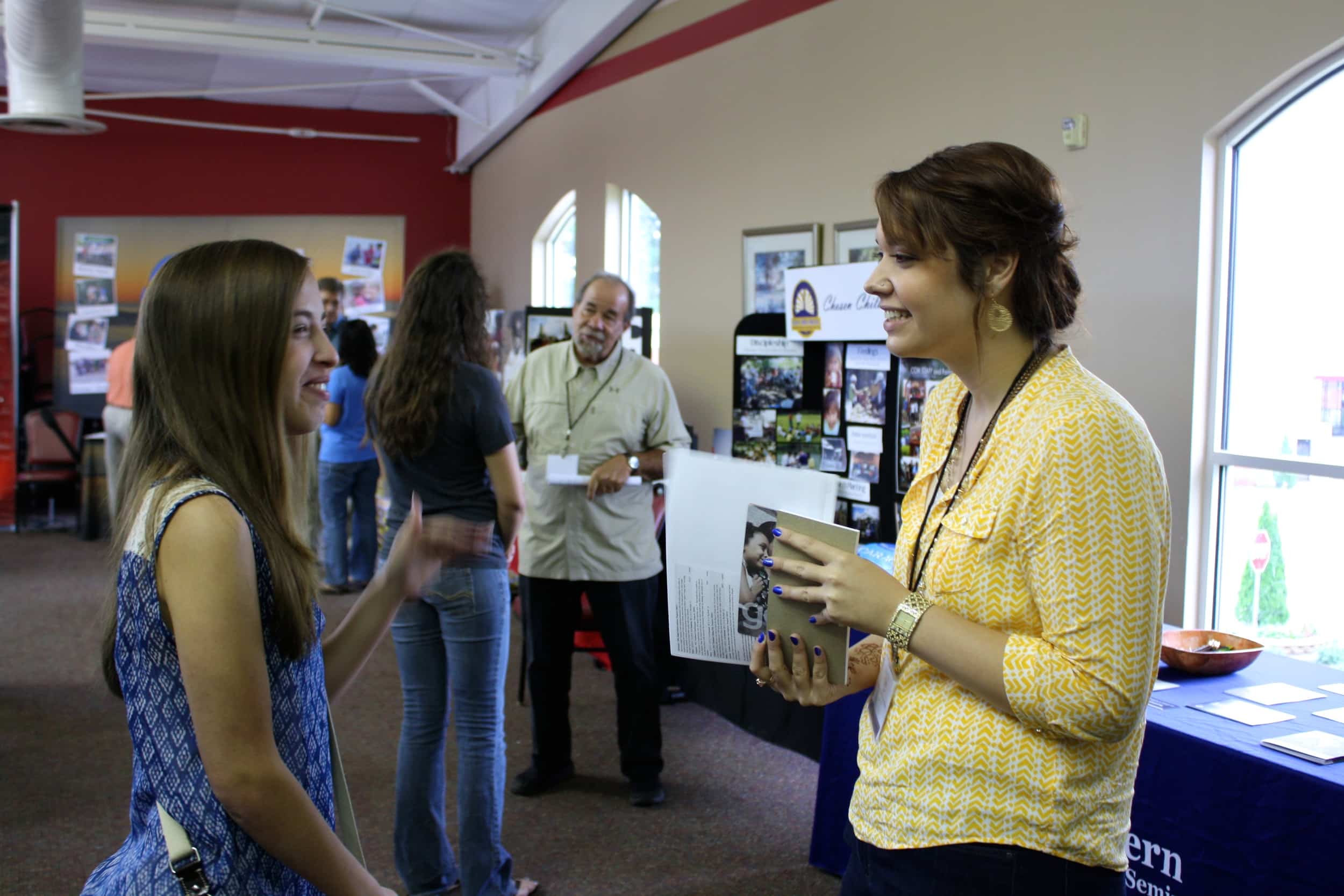  A student and a missionary laugh together during NGU's global missions week September 8-10. 