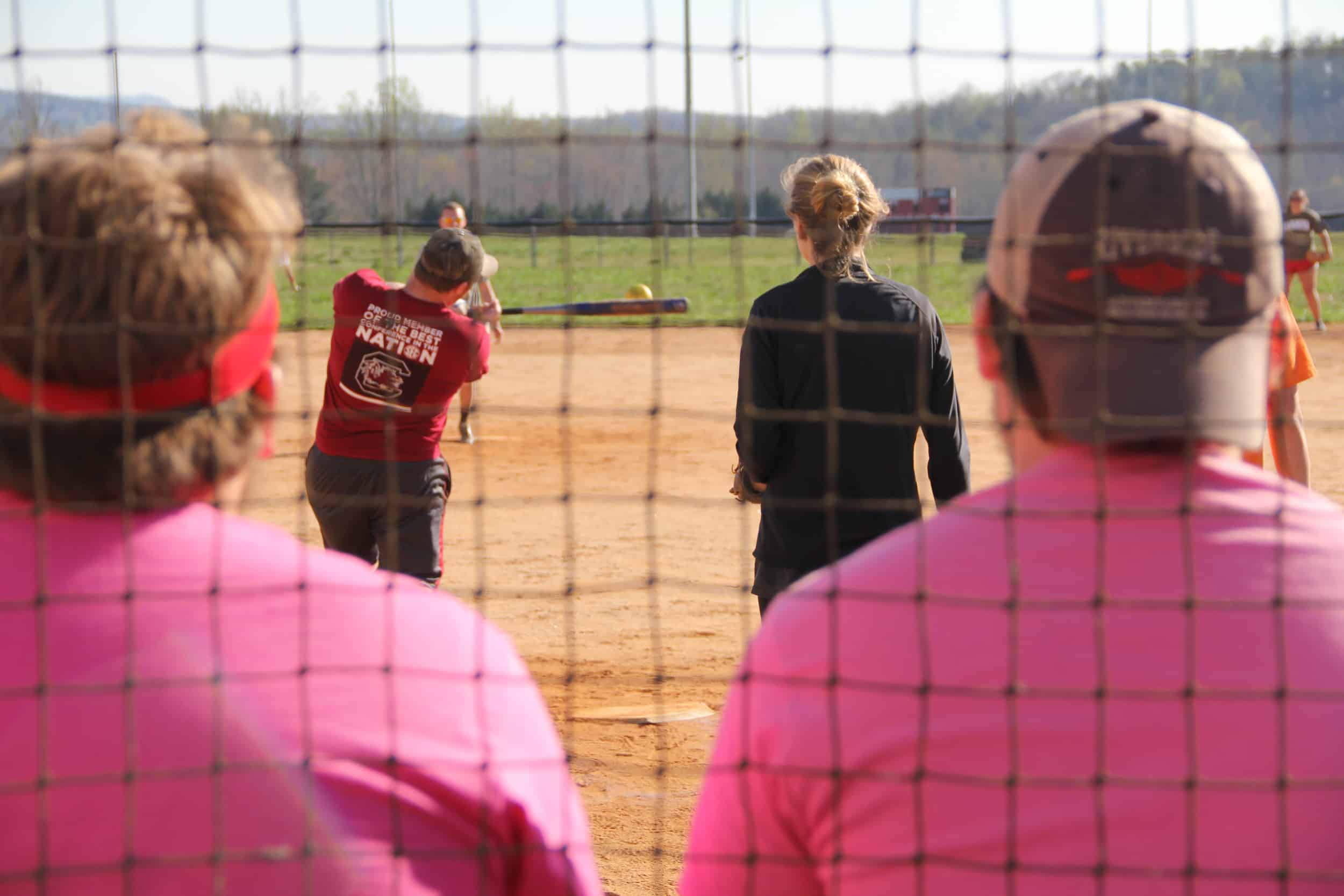  Seth Williams takes his turn at bat as students watch.&nbsp; 