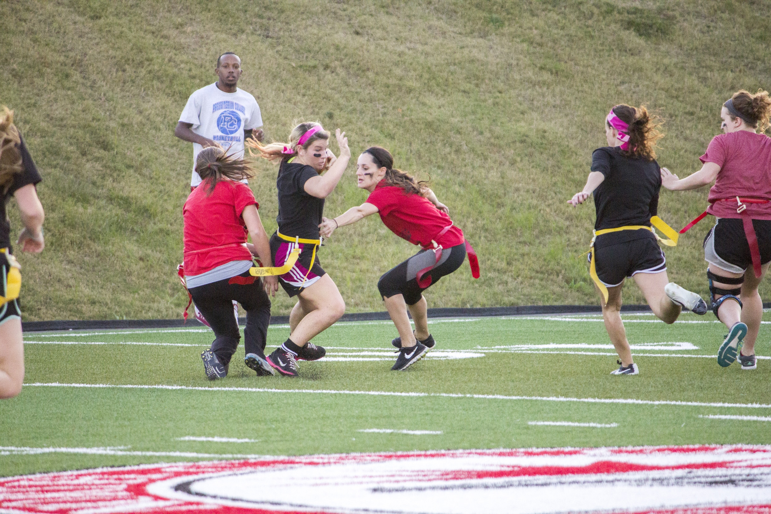  Junior Alexandria Cloer uses her footwork to step to the side to avoid her flag from being pulled.&nbsp; 