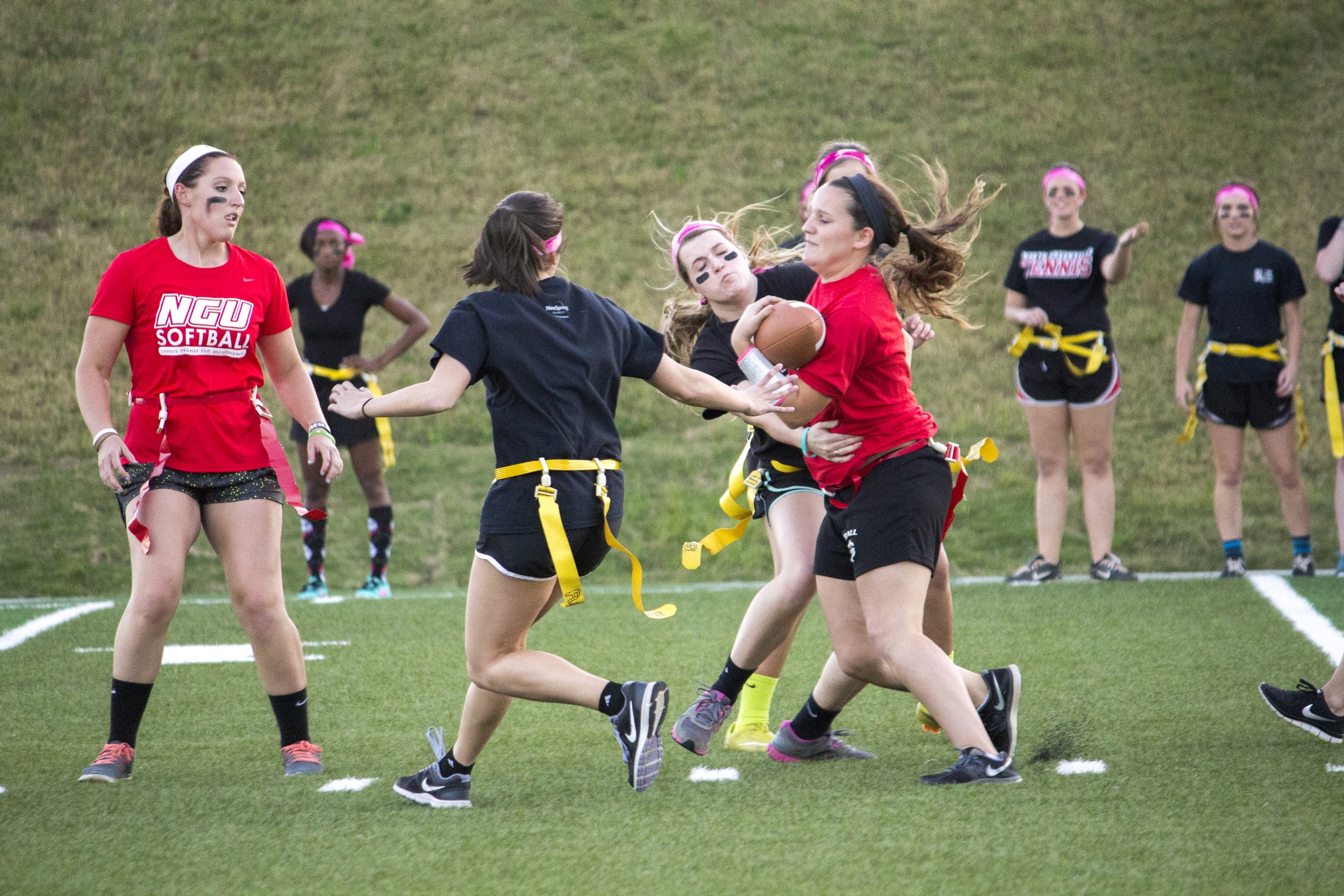  Senior Cassi Carpenter attempts to run past the onslaught of juniors trying to pull her flag 