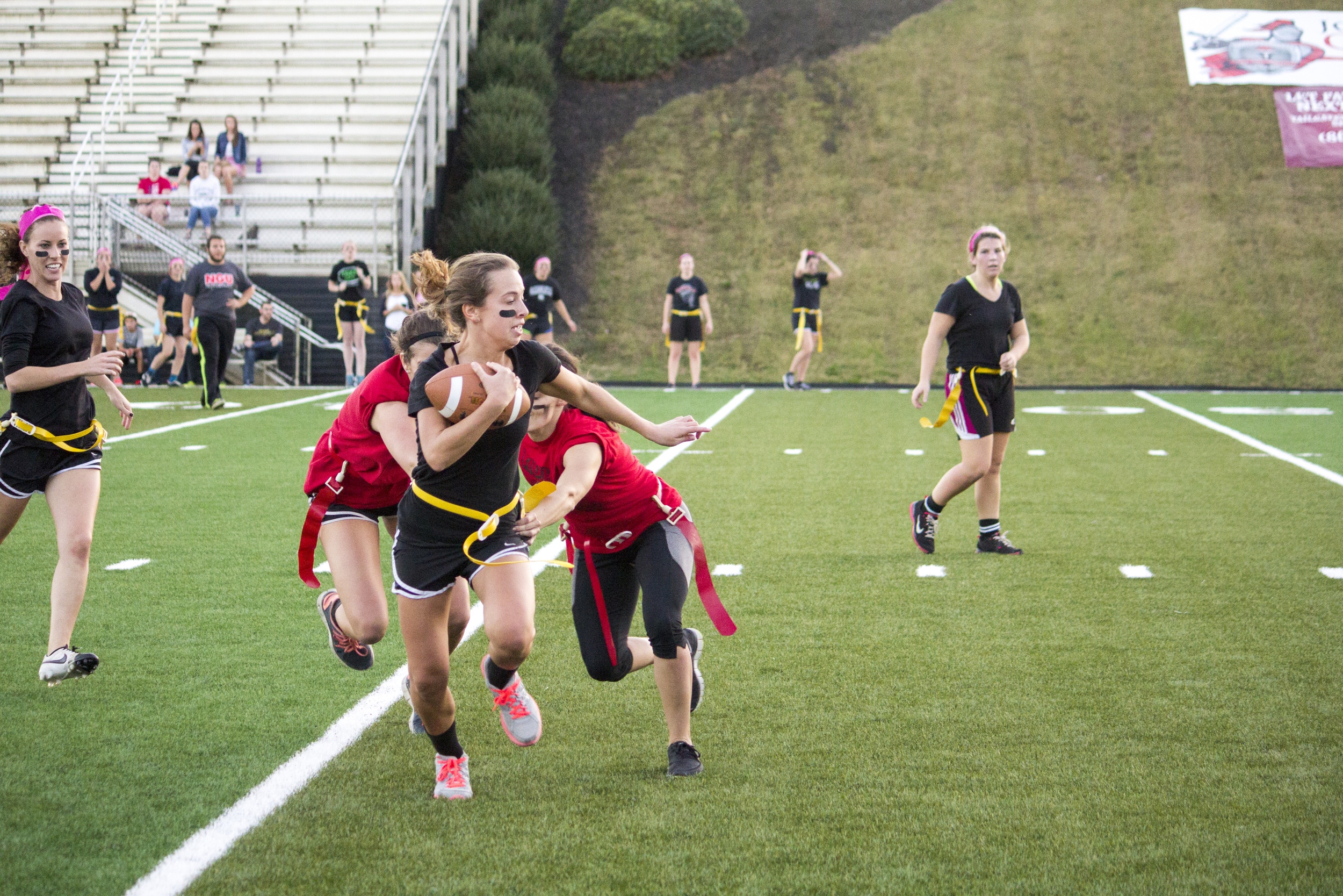  Junior Kacey Beck barely makes it past two junior players stretched out to grab her flag. 