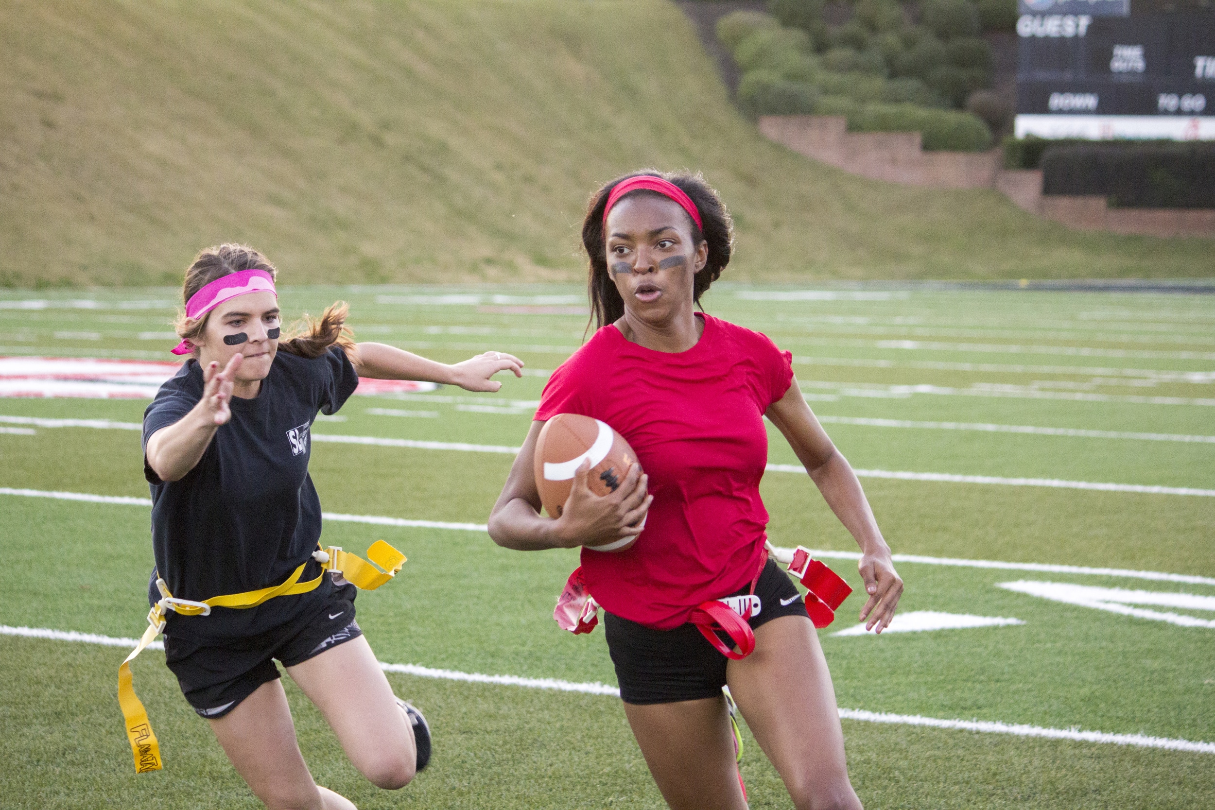  Senior Jackia Whetstone tries to avoid a rival junior player from snagging her flag.&nbsp; 